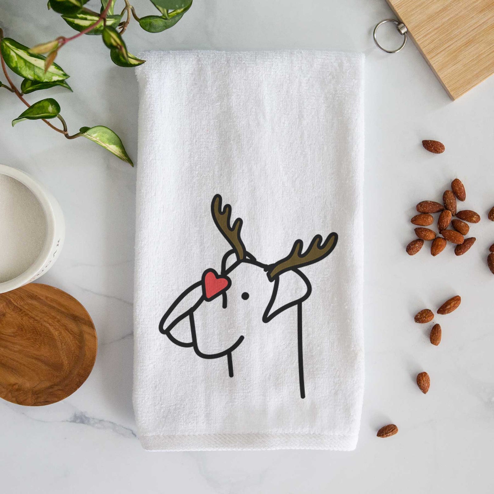 Minimalist line drawing of a Boxer with reindeer antlers and a red nose on a decorative hand towel