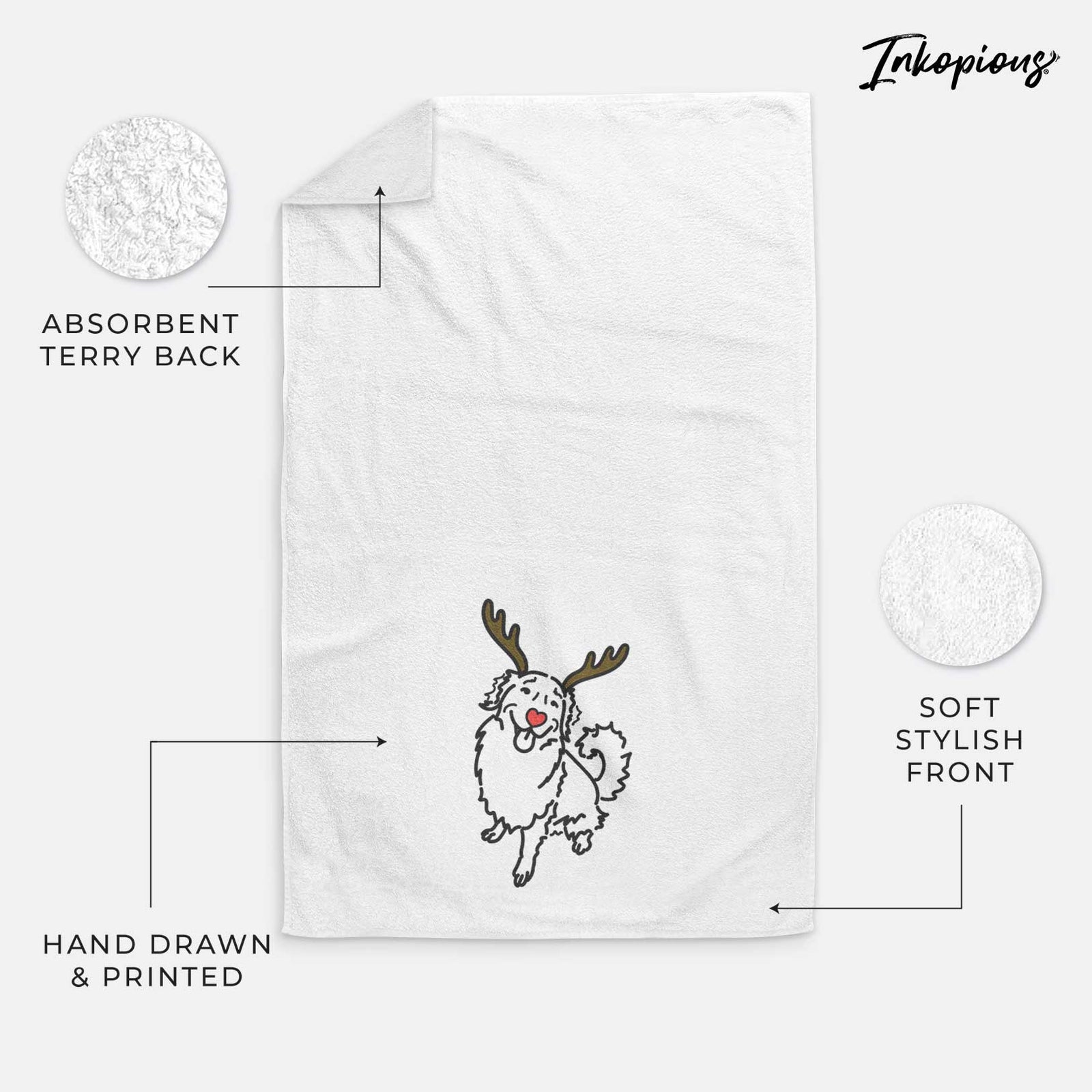Minimalist line drawing of Brinkley the Golden Retriever with reindeer antlers and a red nose on a decorative hand towel