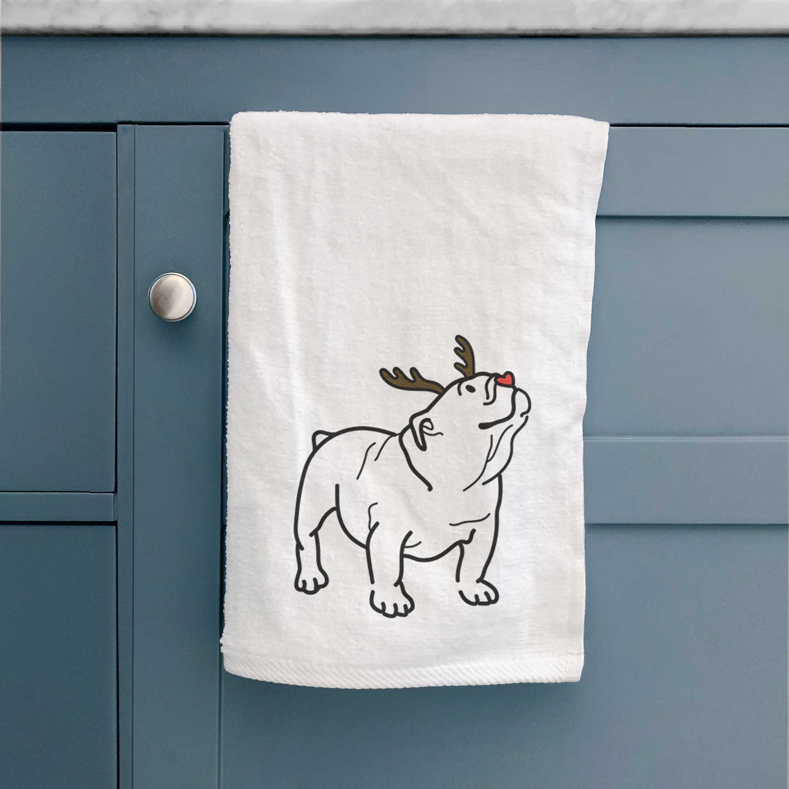 Minimalist line drawing of Bruno the English Bulldog with reindeer antlers and a red nose on a decorative hand towel