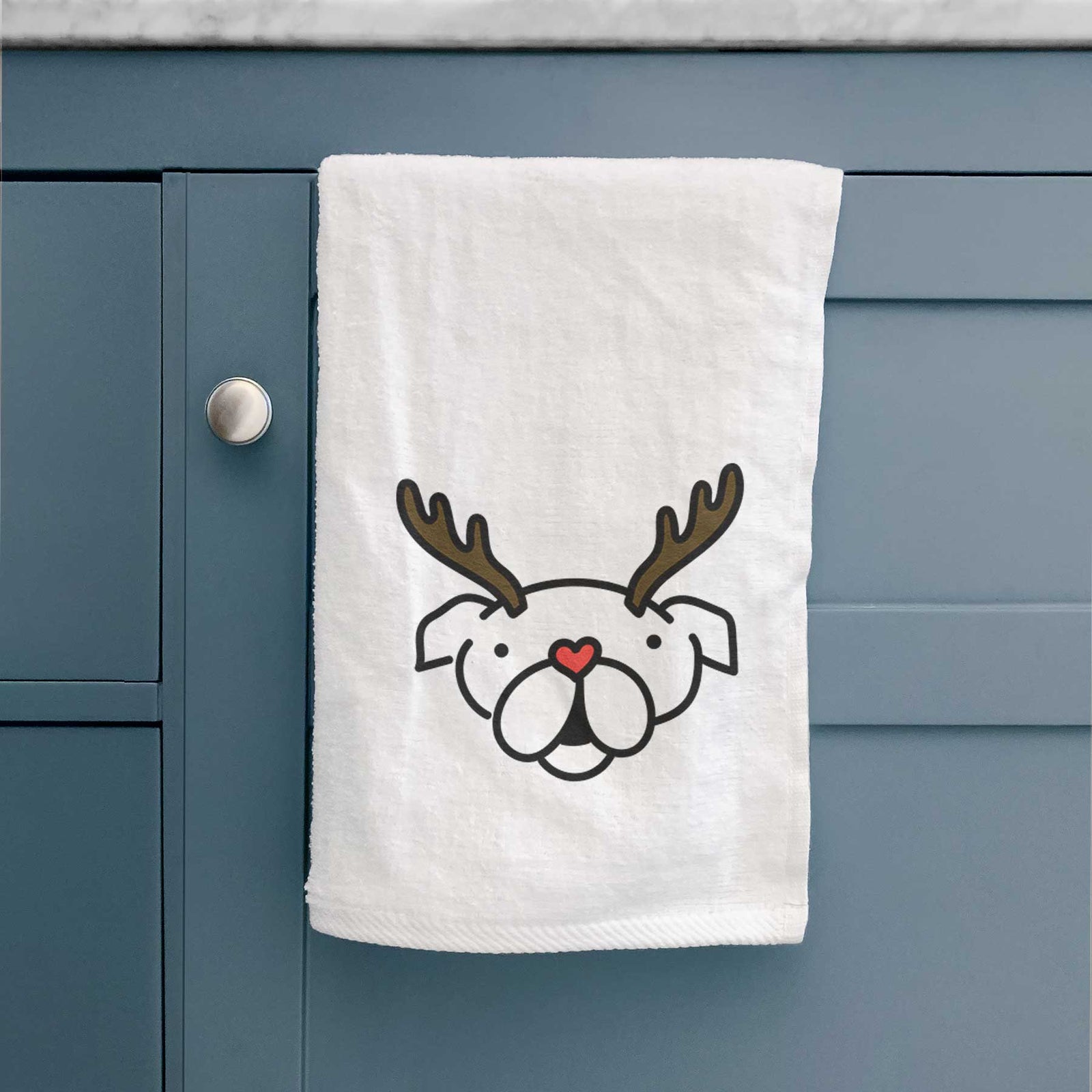 Minimalist line drawing of an English Bulldog with reindeer antlers and a red nose on a decorative hand towel