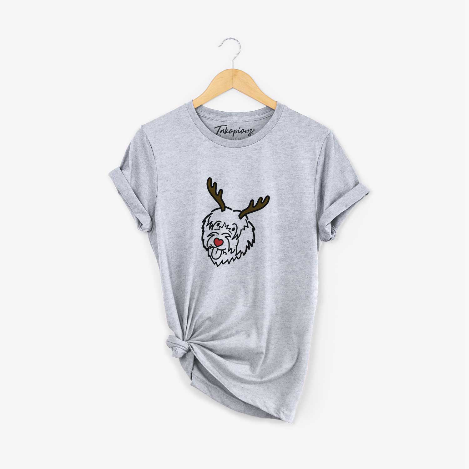 Minimalist line drawing of a Catalan Sheepdog with reindeer antlers and a red nose on a Grey Unisex crewneck