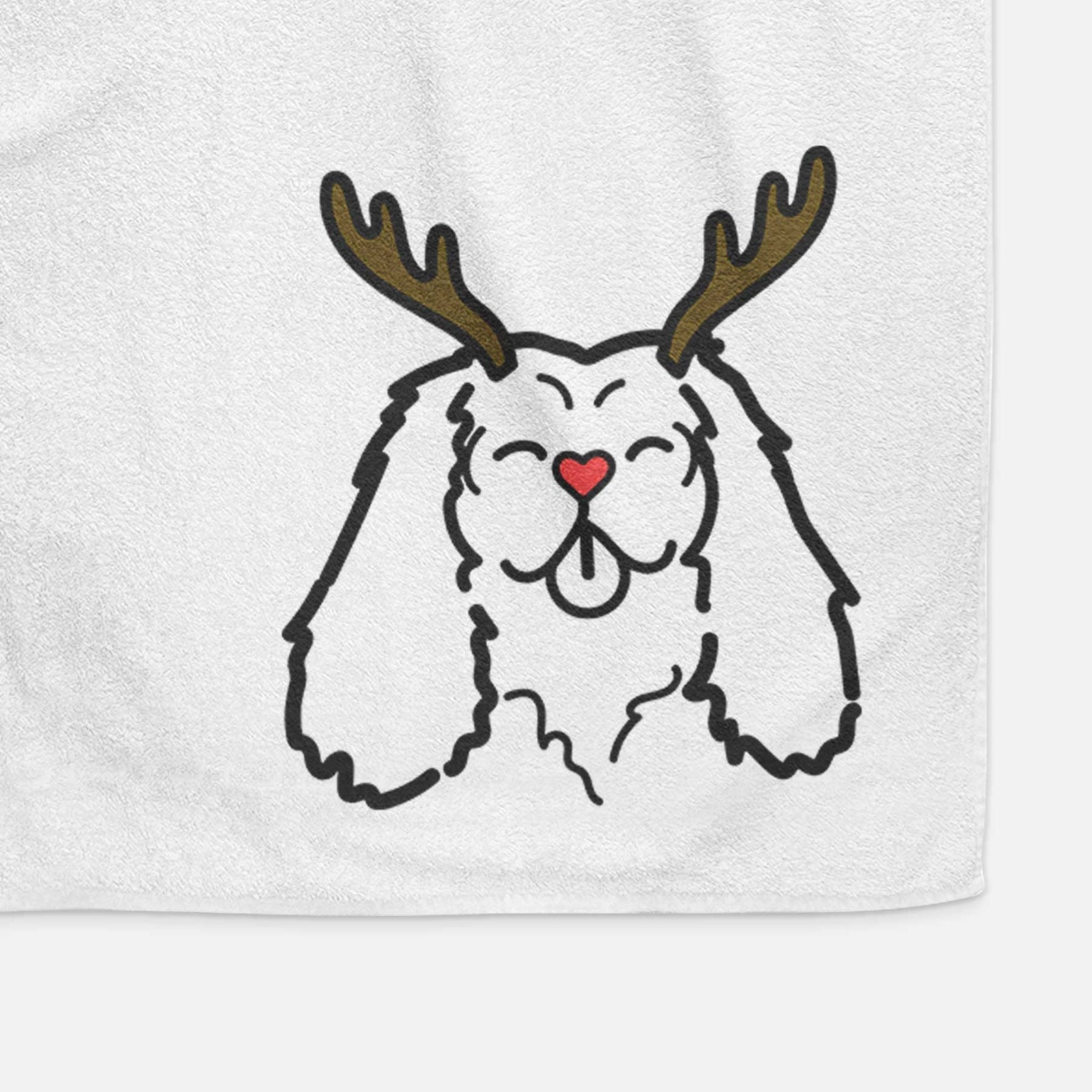 Minimalist line drawing of a Cavalier King Charles Spaniel with reindeer antlers and a red nose on a decorative hand towel
