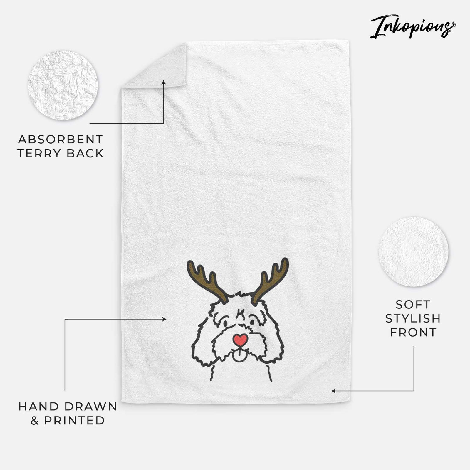 Minimalist line drawing of a Cavapoo with reindeer antlers and a red nose on a decorative hand towel
