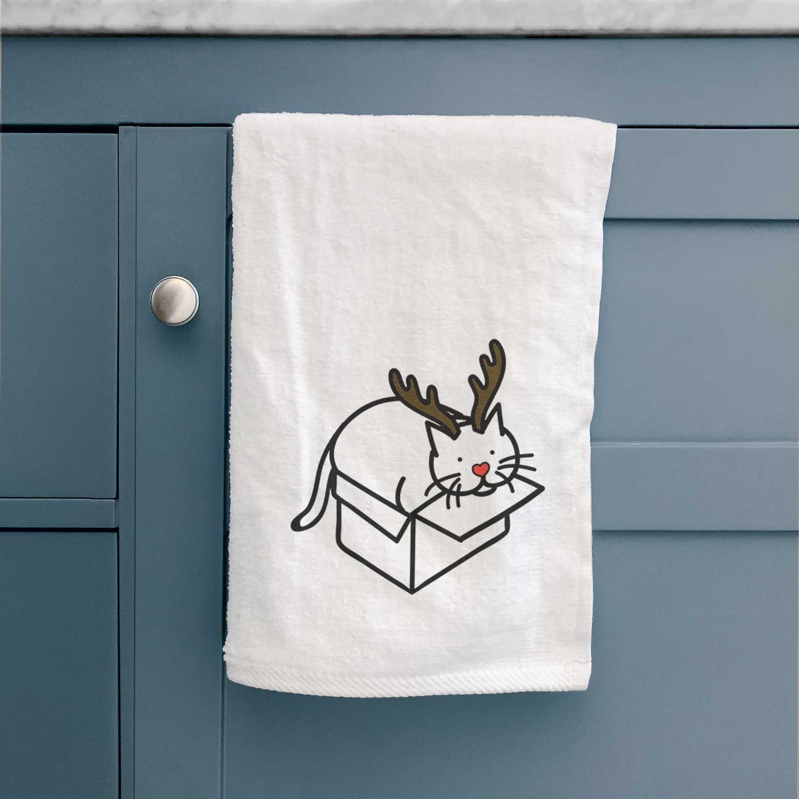 Minimalist line drawing of Charlie the Cat in a Box with reindeer antlers and a red nose on a decorative hand towel