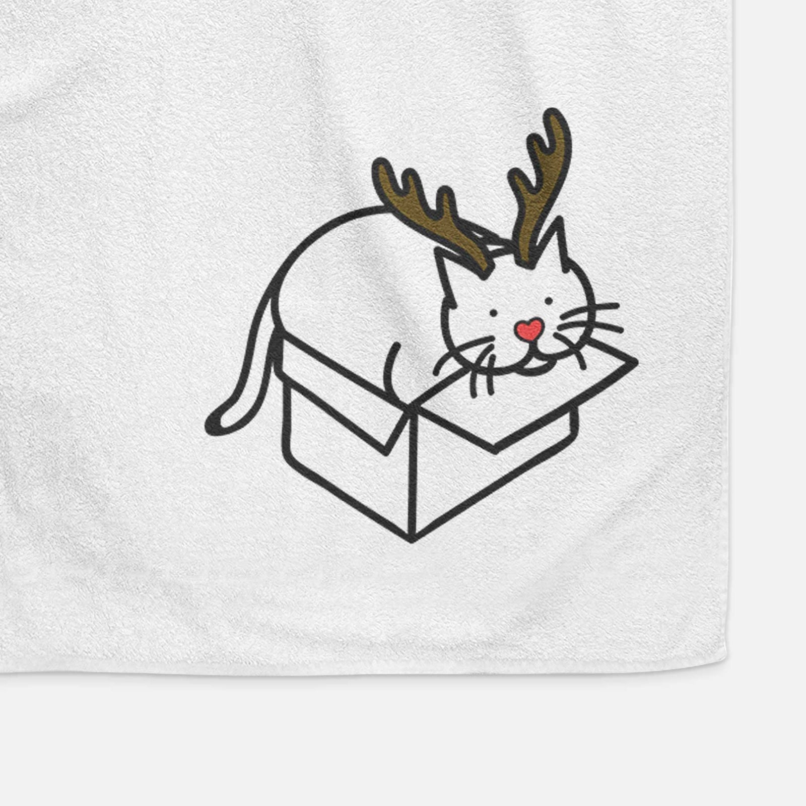 Minimalist line drawing of Charlie the Cat in a Box with reindeer antlers and a red nose on a decorative hand towel