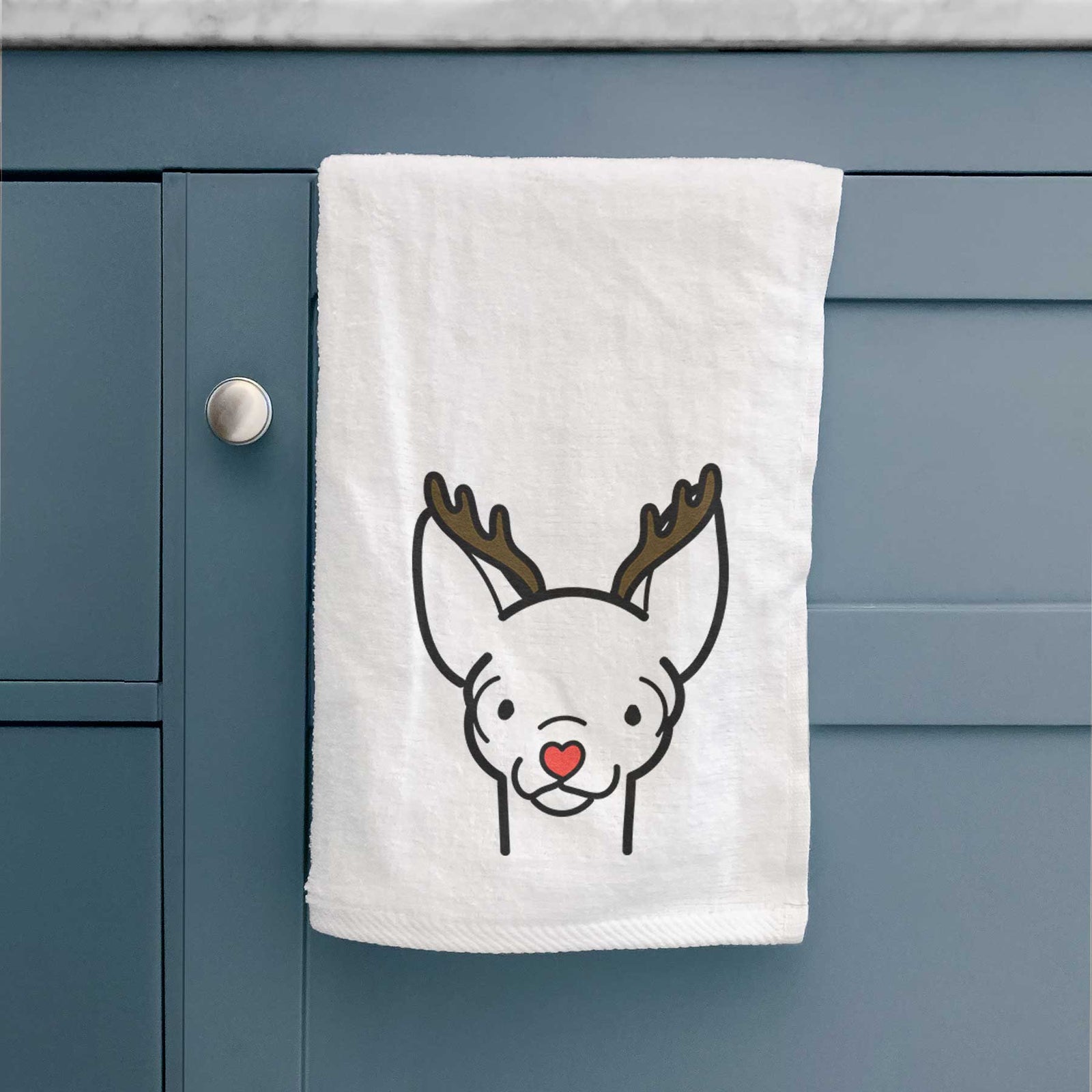 Minimalist line drawing of a Chihuahua with reindeer antlers and a red nose on a decorative hand towel