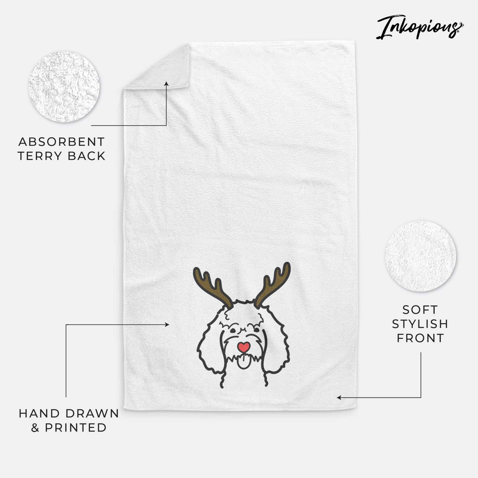 Minimalist line drawing of a Cockapoo with reindeer antlers and a red nose on a decorative hand towel