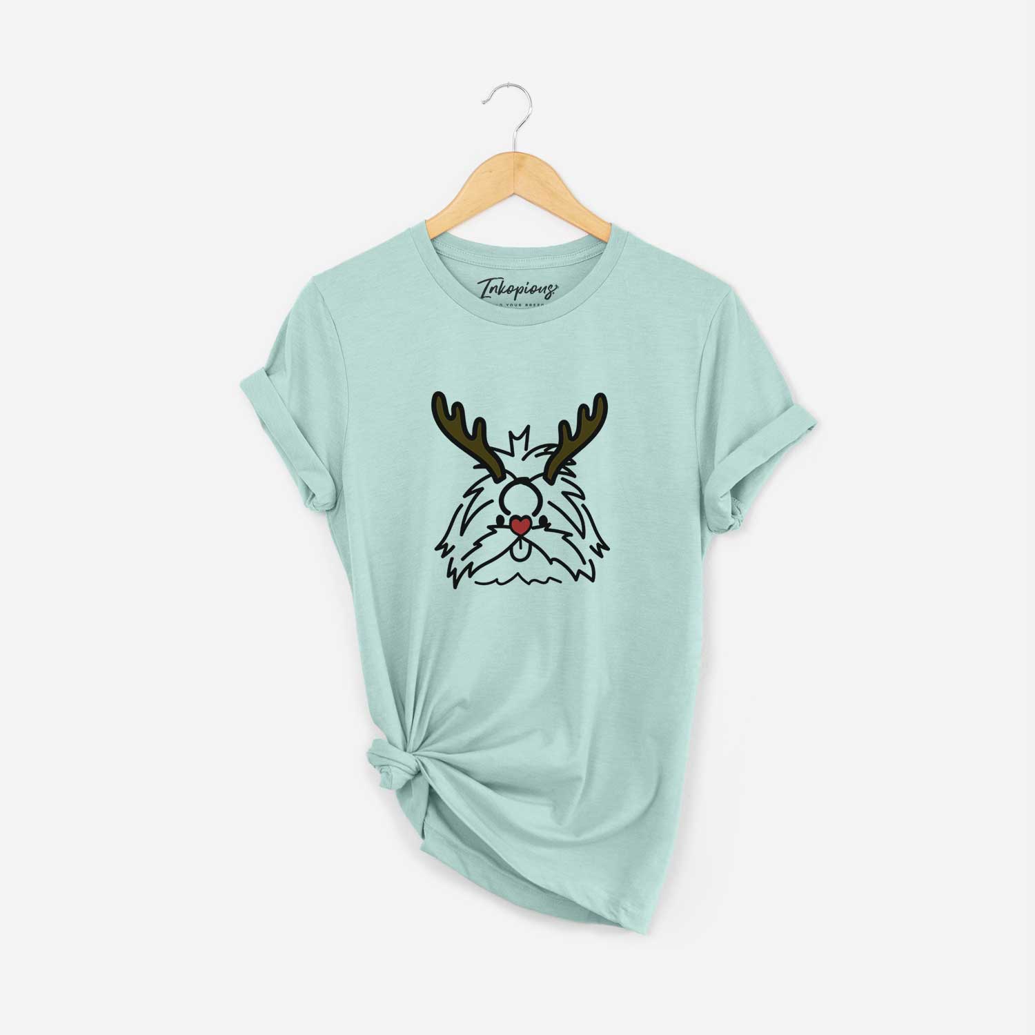 Minimalist line drawing of CoCo the Shih Tzu with reindeer antlers and a red nose on a Heather Sage Unisex crewneck