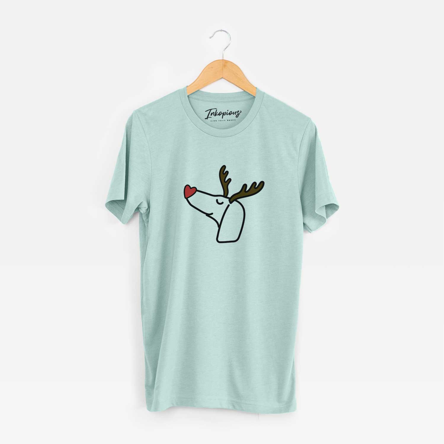 Minimalist line drawing of a Dachshund with reindeer antlers and a red nose on a Heather Sage Unisex crewneck