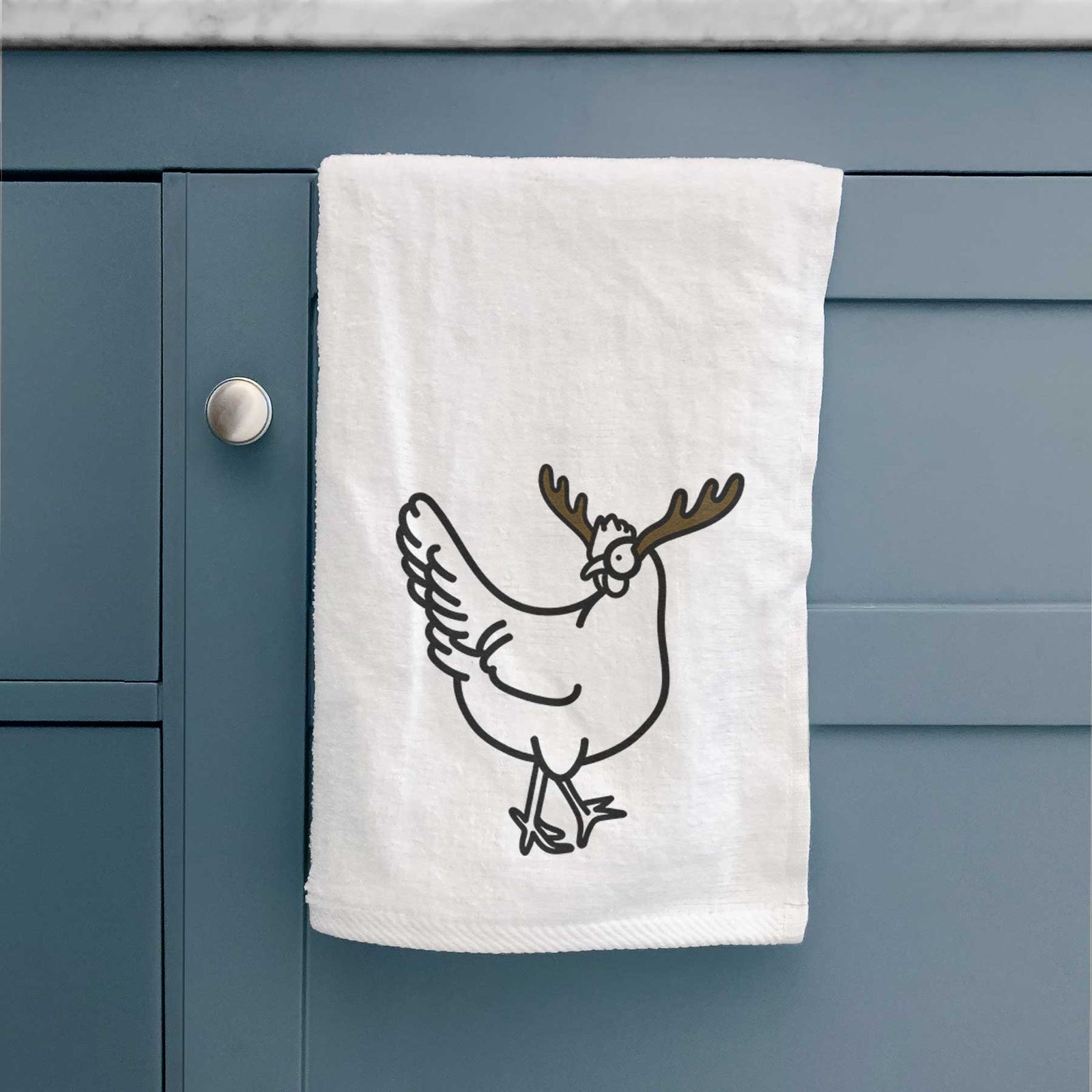 Minimalist line drawing of Daisy the Chicken with reindeer antlers and a red nose on a decorative hand towel