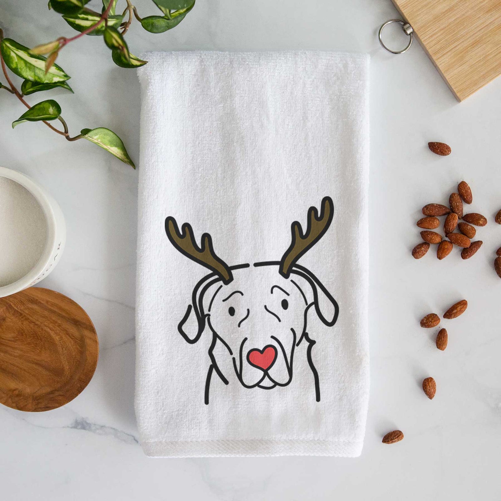 Minimalist line drawing of an English Labrador with reindeer antlers and a red nose on a decorative hand towel