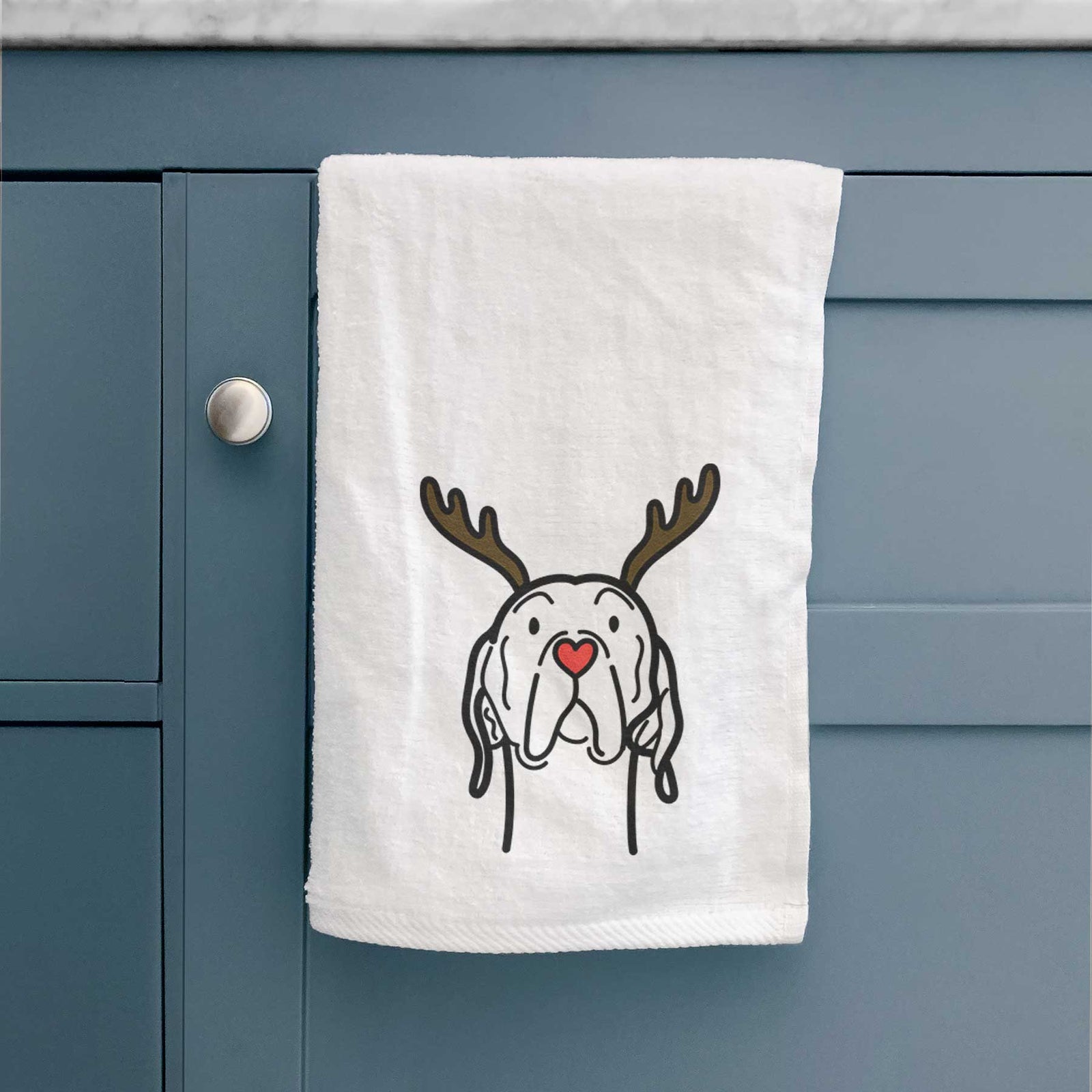 Minimalist line drawing of an English Pointer with reindeer antlers and a red nose on a decorative hand towel