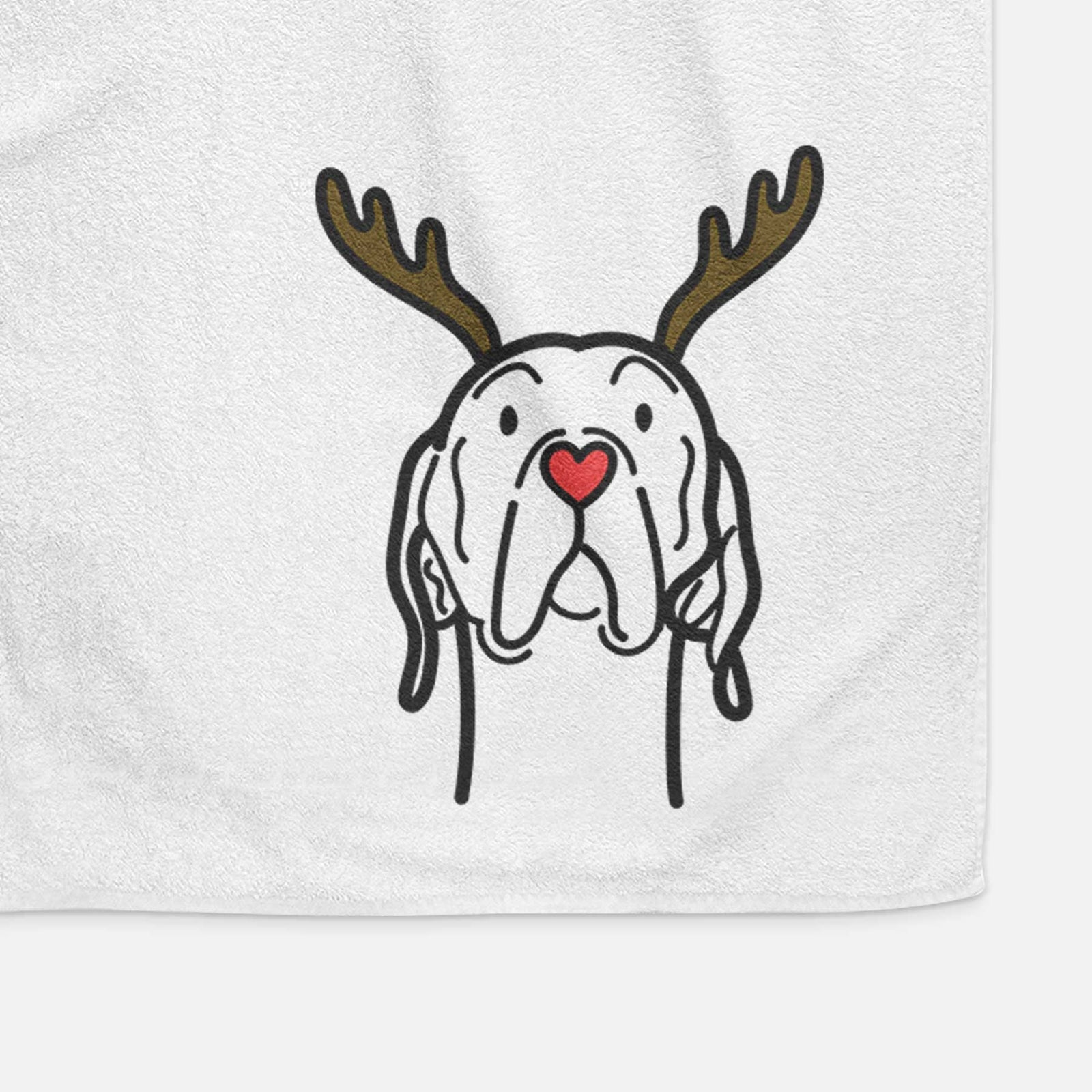Minimalist line drawing of an English Pointer with reindeer antlers and a red nose on a decorative hand towel