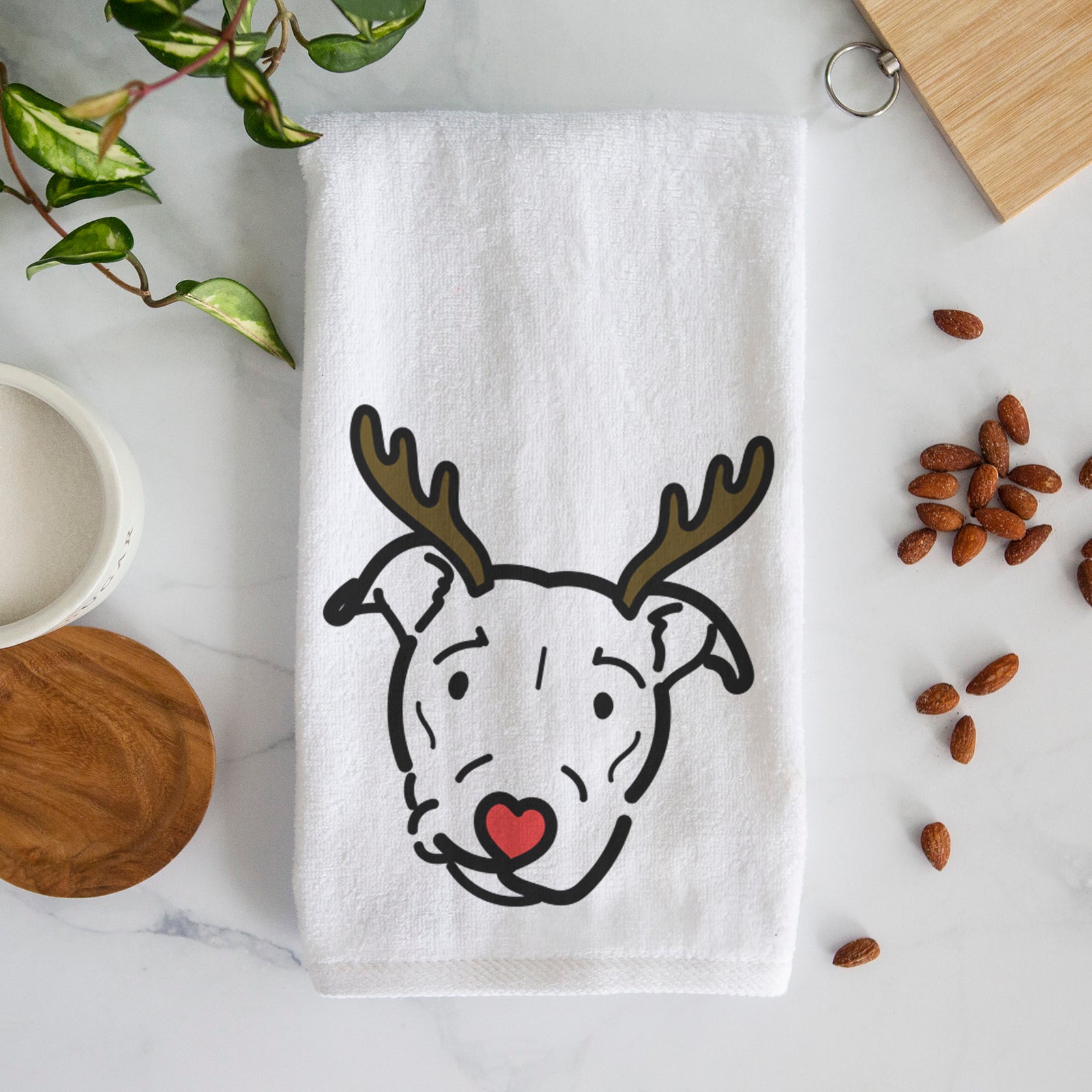 Minimalist line drawing of Ernie the Pitbull Mix with reindeer antlers and a red nose on a decorative hand towel