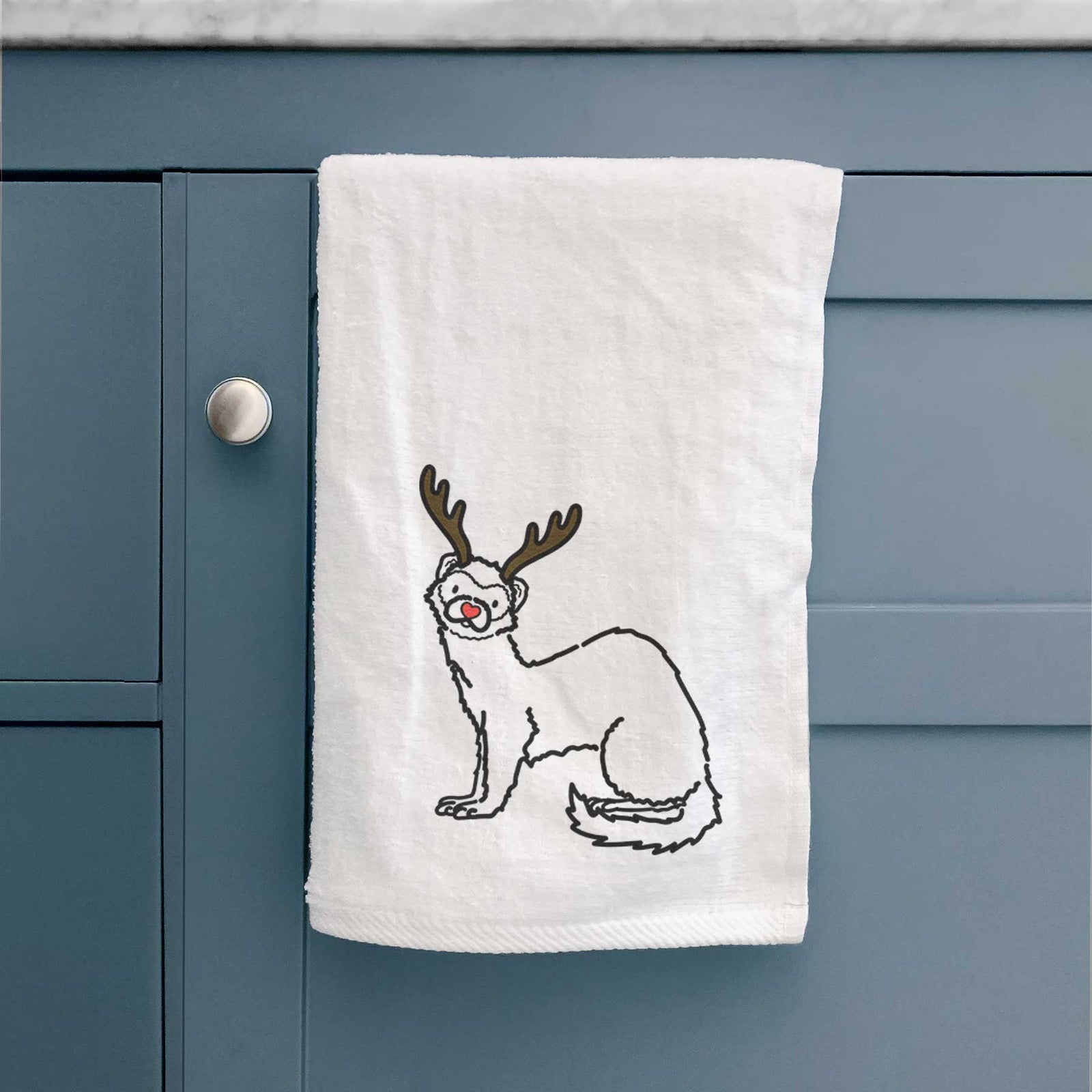 Minimalist line drawing of Fern the Ferret with reindeer antlers and a red nose on a decorative hand towel