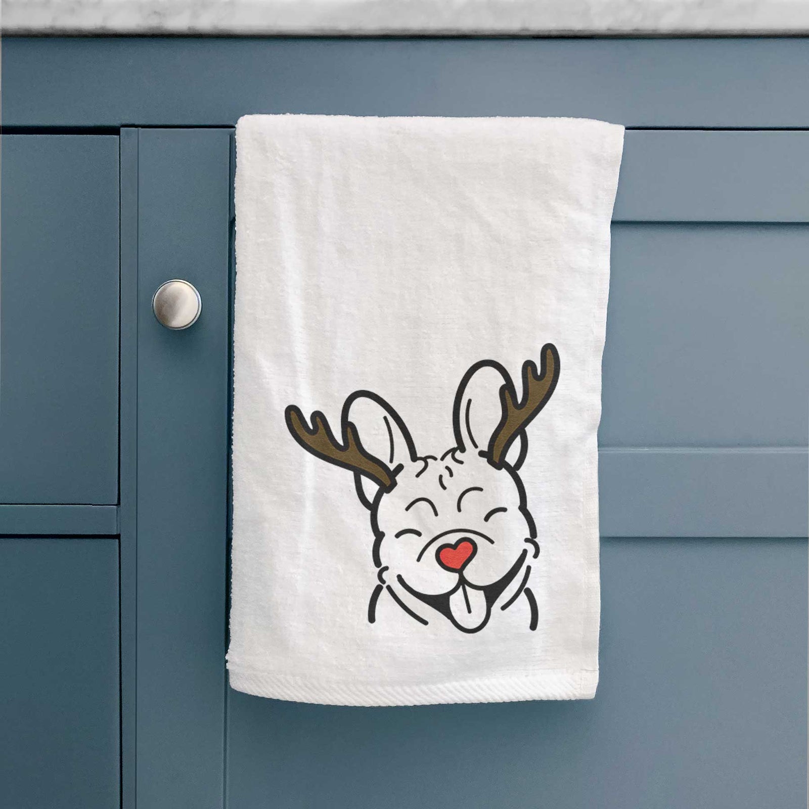 Minimalist line drawing of a French Bulldog with reindeer antlers and a red nose on a decorative hand towel