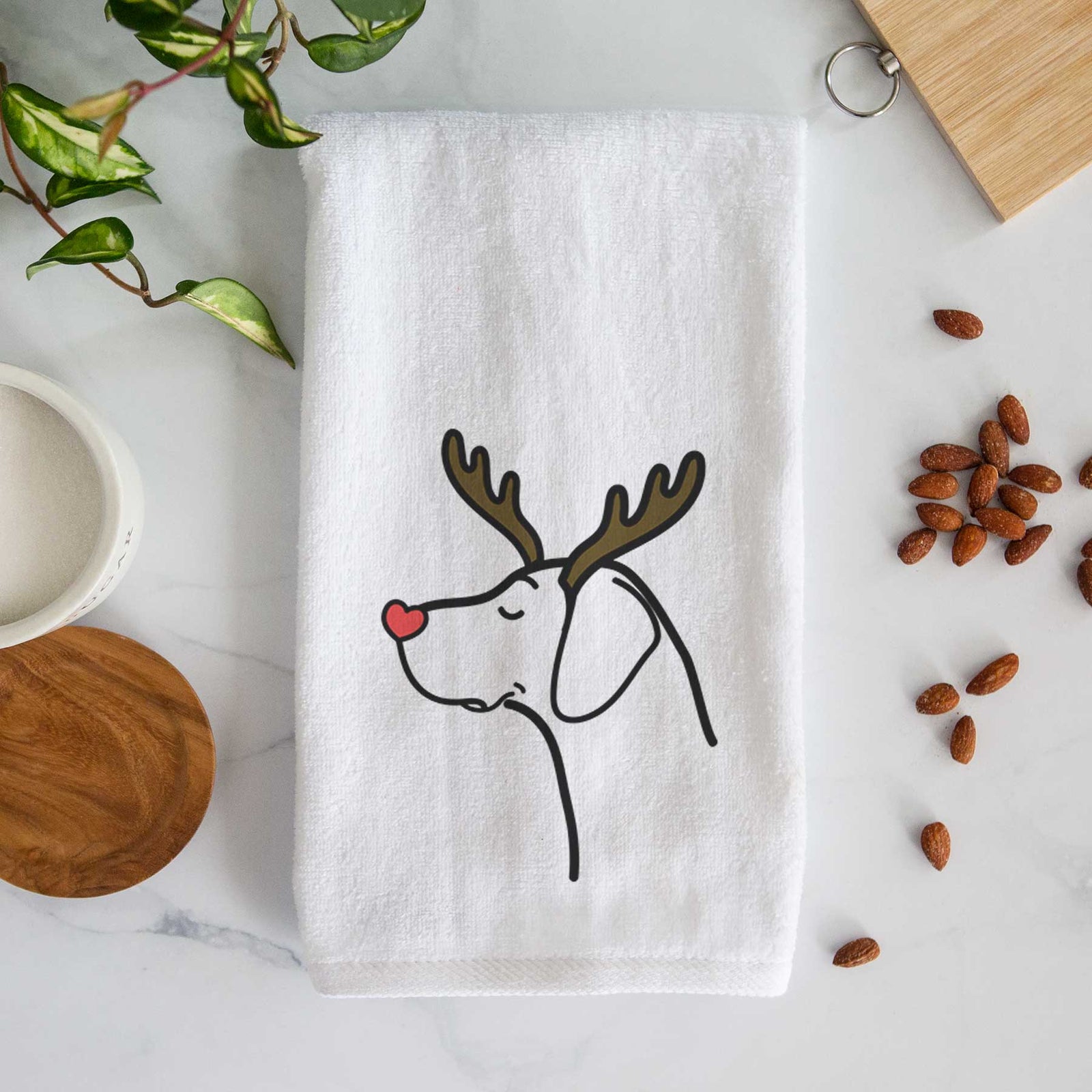 Minimalist line drawing of a German Shorthaired Pointer with reindeer antlers and a red nose on a decorative hand towel
