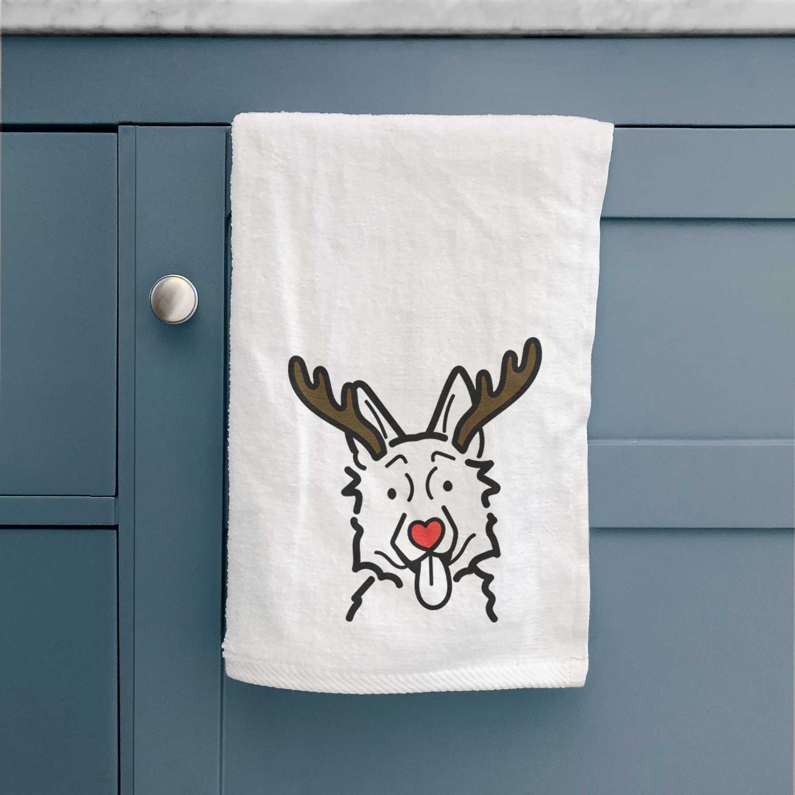 Minimalist line drawing of a German Shepherd with reindeer antlers and a red nose on a decorative hand towel