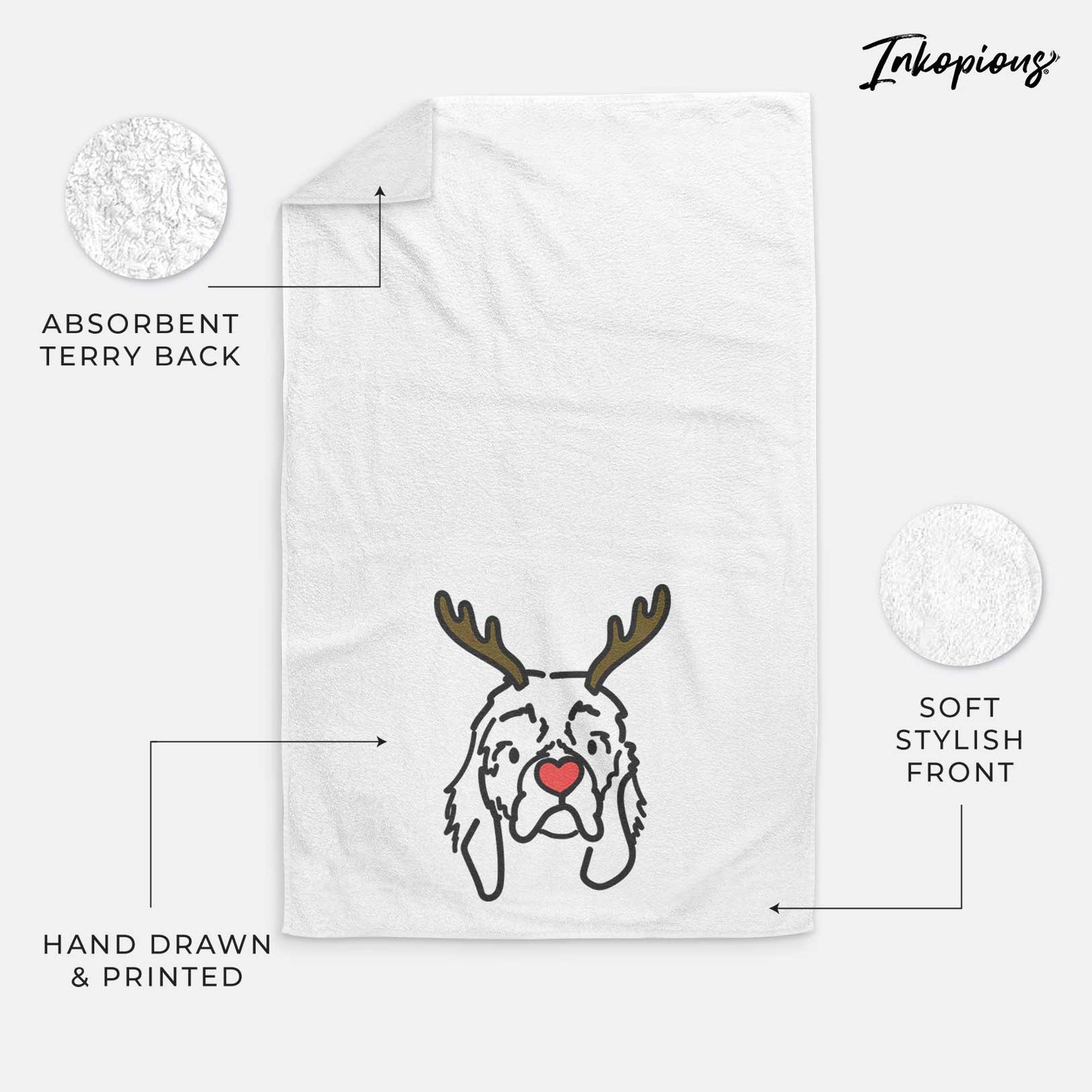 Minimalist line drawing of GiGi the Cocker Spaniel with reindeer antlers and a red nose on a decorative hand towel