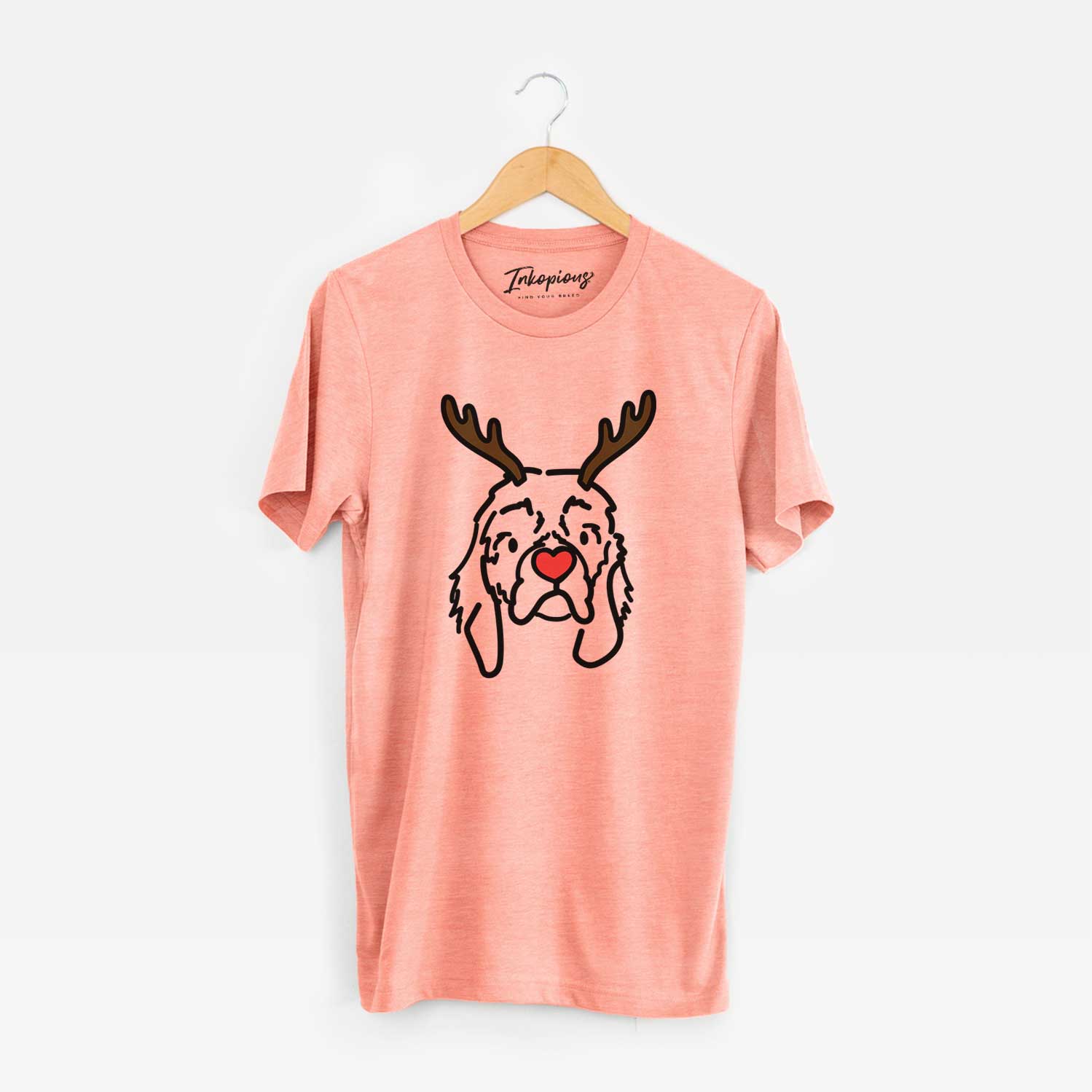 Minimalist line drawing of GiGi the Cocker Spaniel with reindeer antlers and a red nose on a Sunset Unisex crewneck