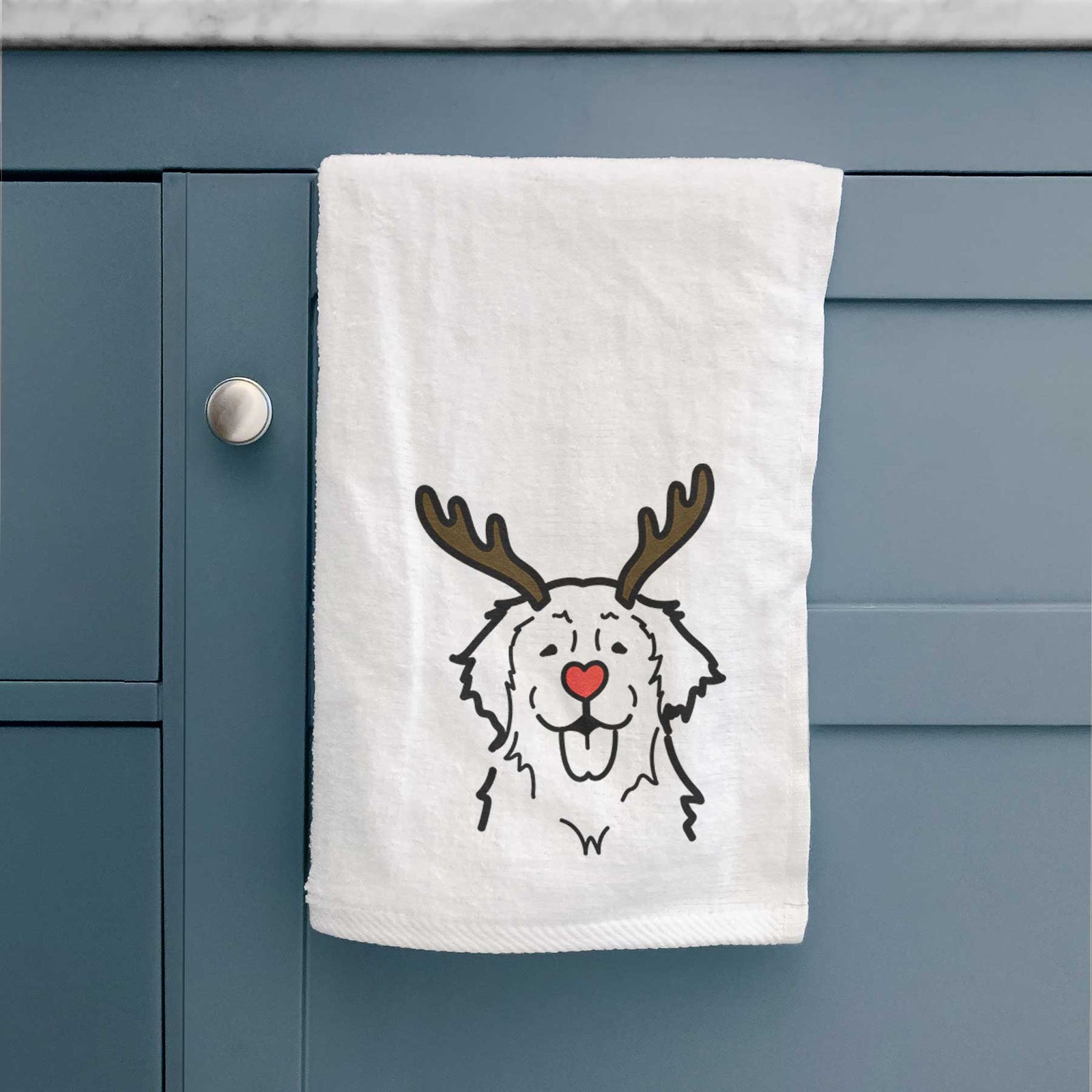 Minimalist line drawing of a Golden Retriever with reindeer antlers and a red nose on a decorative hand towel