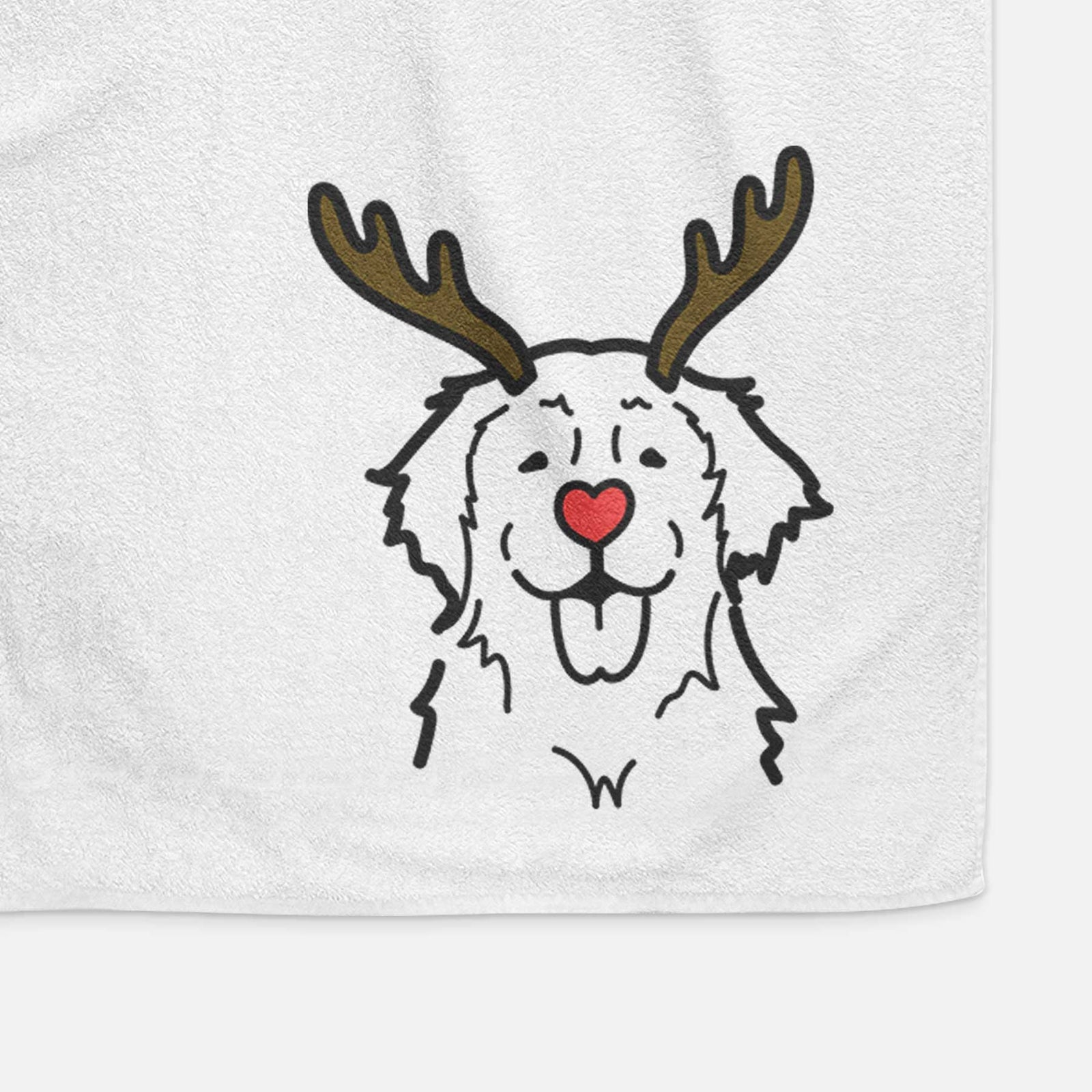 Minimalist line drawing of a Golden Retriever with reindeer antlers and a red nose on a decorative hand towel