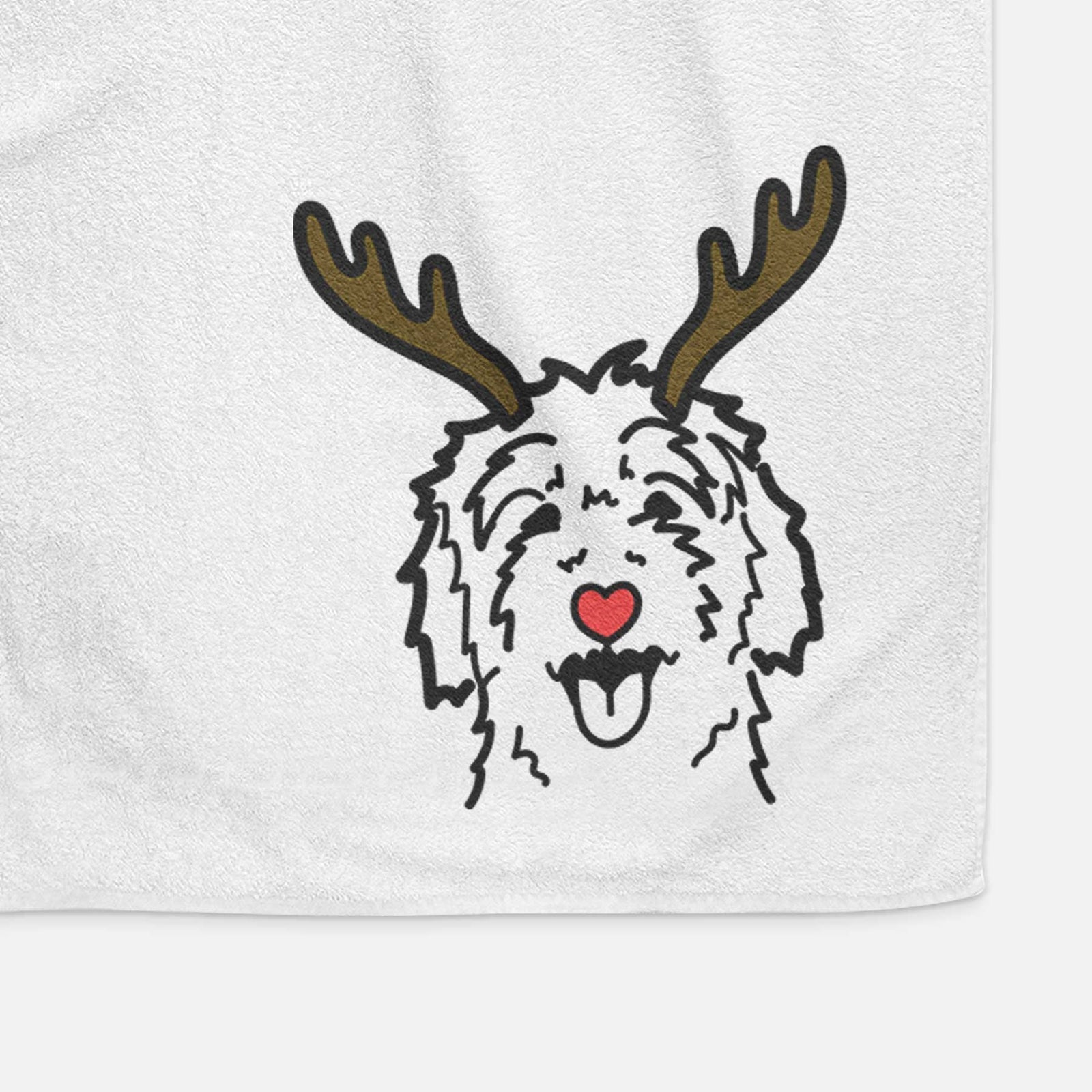 Minimalist line drawing of a Goldendoodle with reindeer antlers and a red nose on a decorative hand towel
