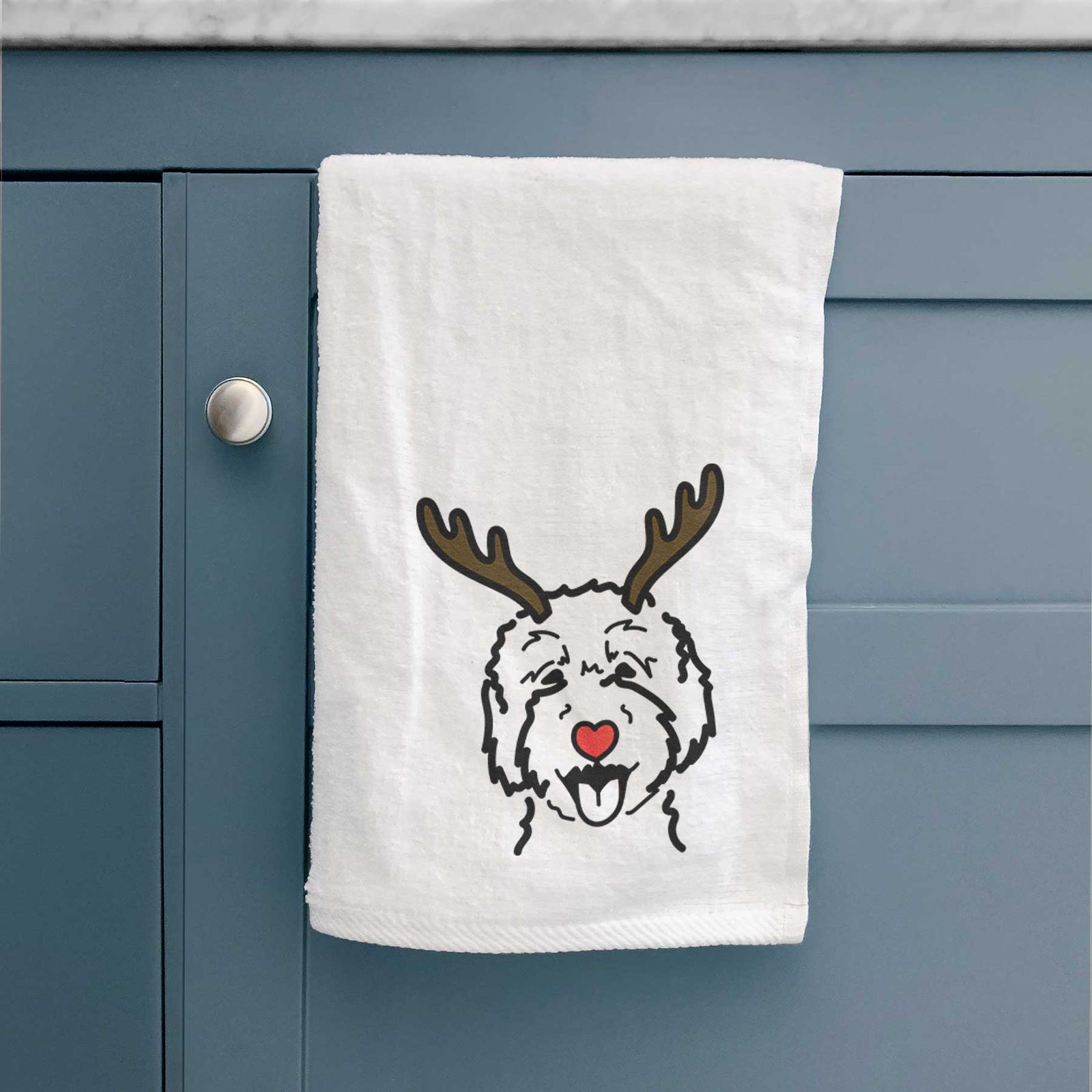 Minimalist line drawing of a Goldendoodle 2 with reindeer antlers and a red nose on a decorative hand towel