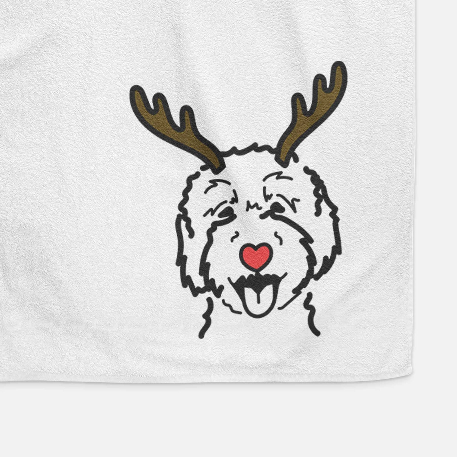 Minimalist line drawing of a Goldendoodle 2 with reindeer antlers and a red nose on a decorative hand towel