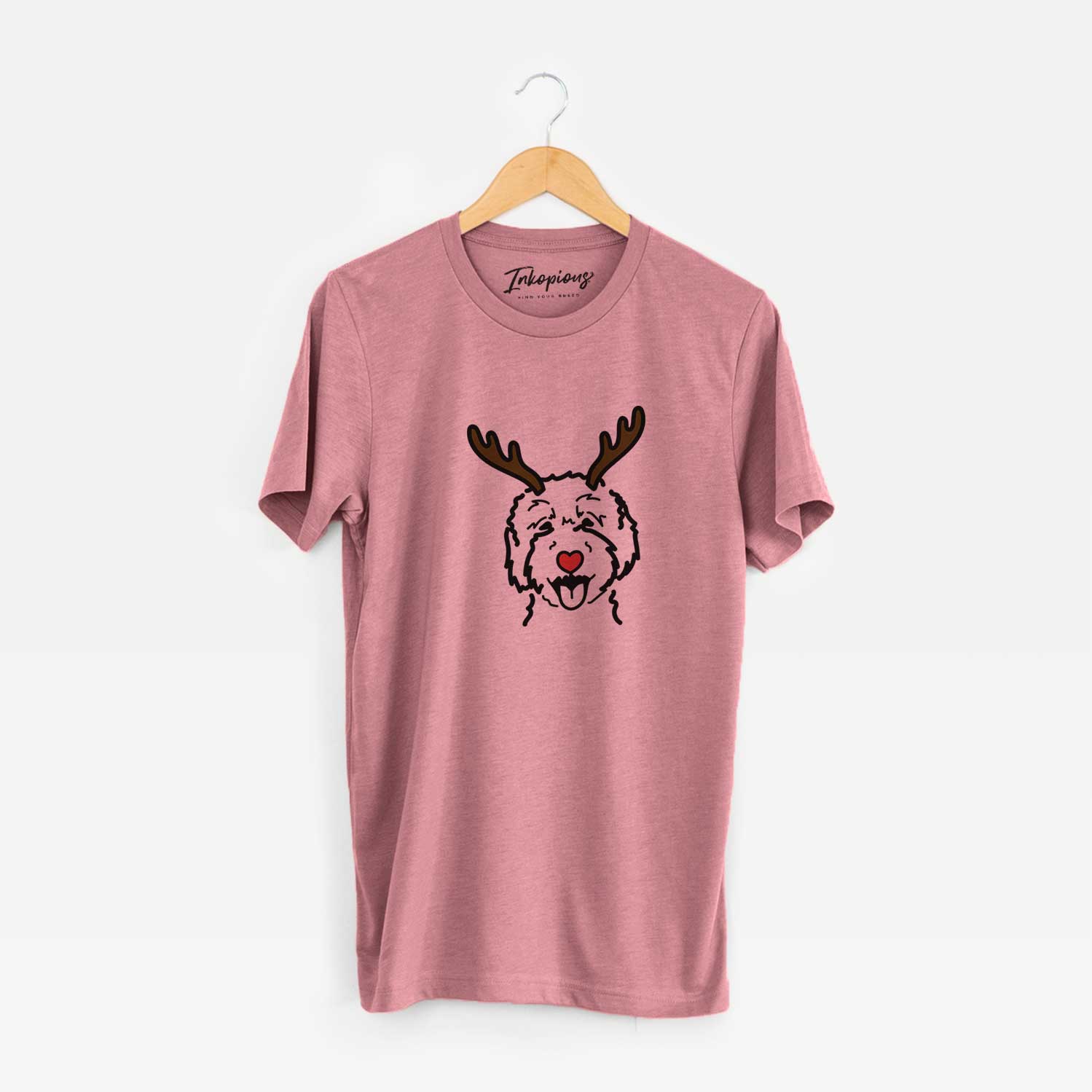 Minimalist line drawing of a Goldendoodle 2 with reindeer antlers and a red nose on a Mauve Unisex crewneck