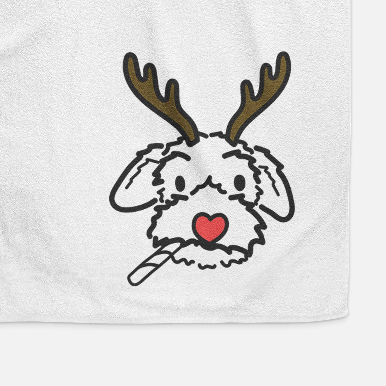 Minimalist line drawing of Gomer the Poodle Mix with reindeer antlers and a red nose on a decorative hand towel