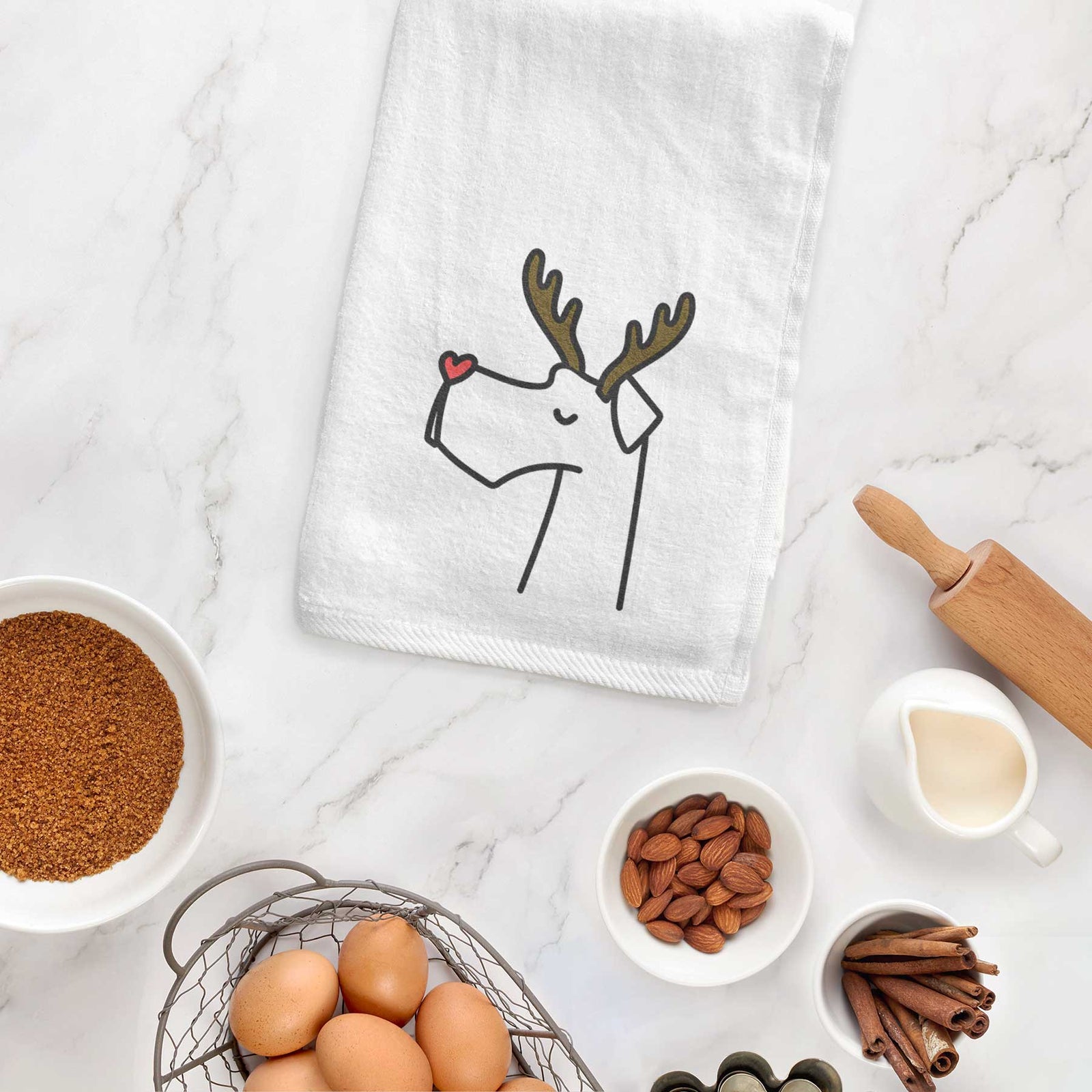 Minimalist line drawing of a Great Dane with reindeer antlers and a red nose on a decorative hand towel