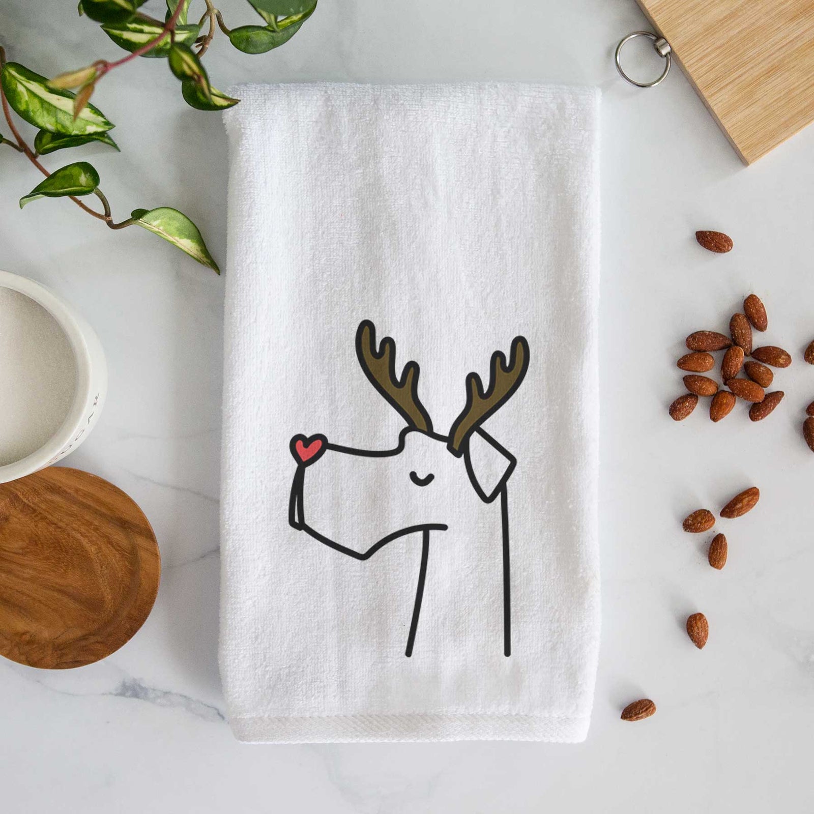 Minimalist line drawing of a Great Dane with reindeer antlers and a red nose on a decorative hand towel