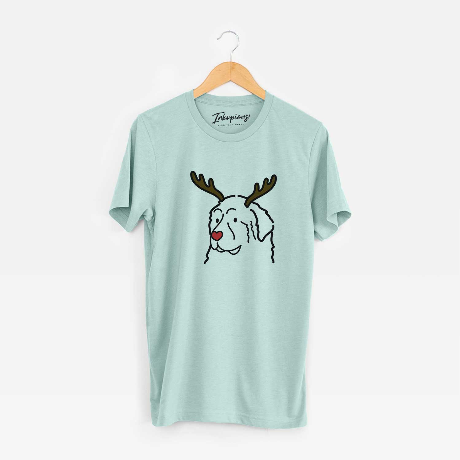 Minimalist line drawing of a Great Pyrenees with reindeer antlers and a red nose on a Heather Sage Unisex crewneck
