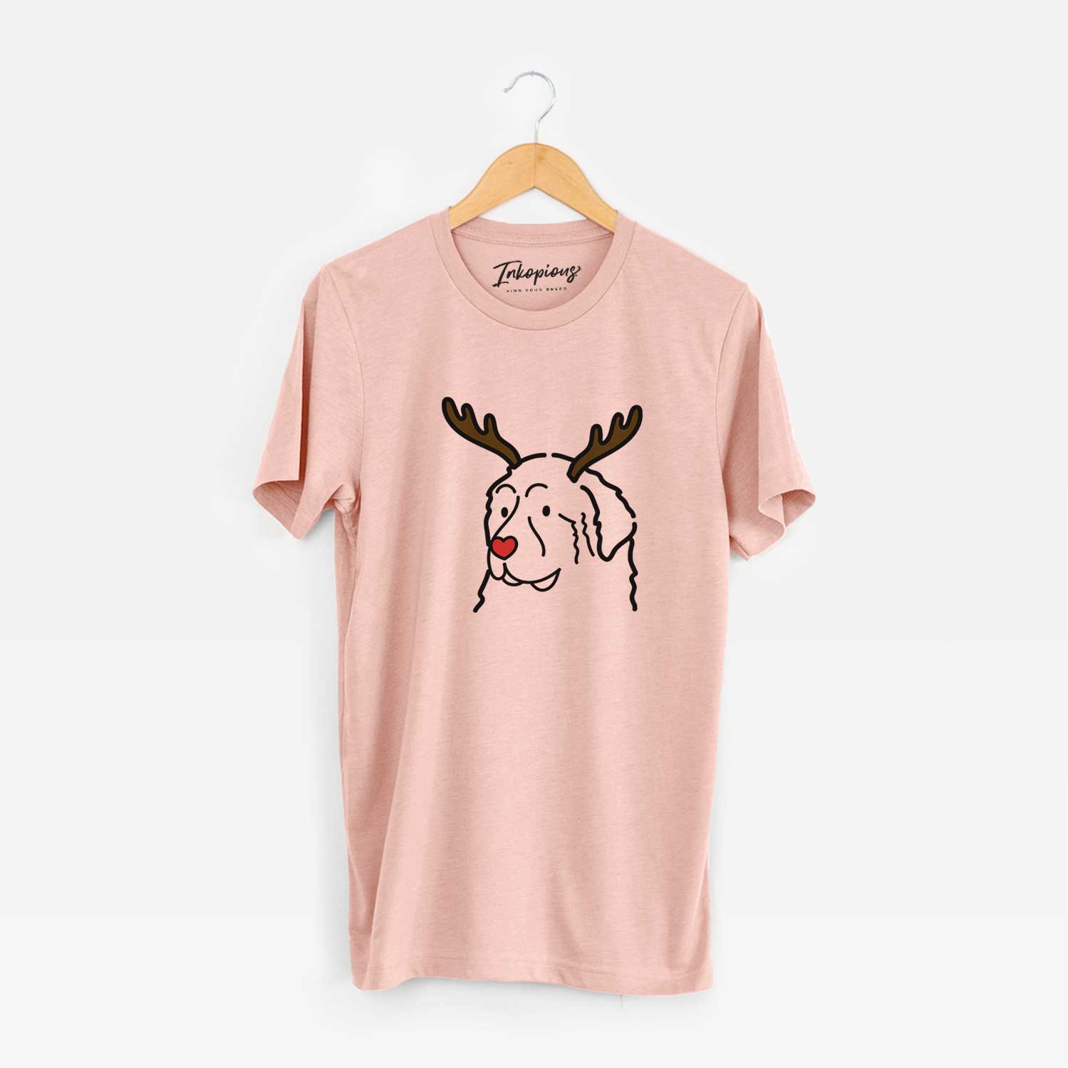Minimalist line drawing of a Great Pyrenees with reindeer antlers and a red nose on a Peach Unisex crewneck