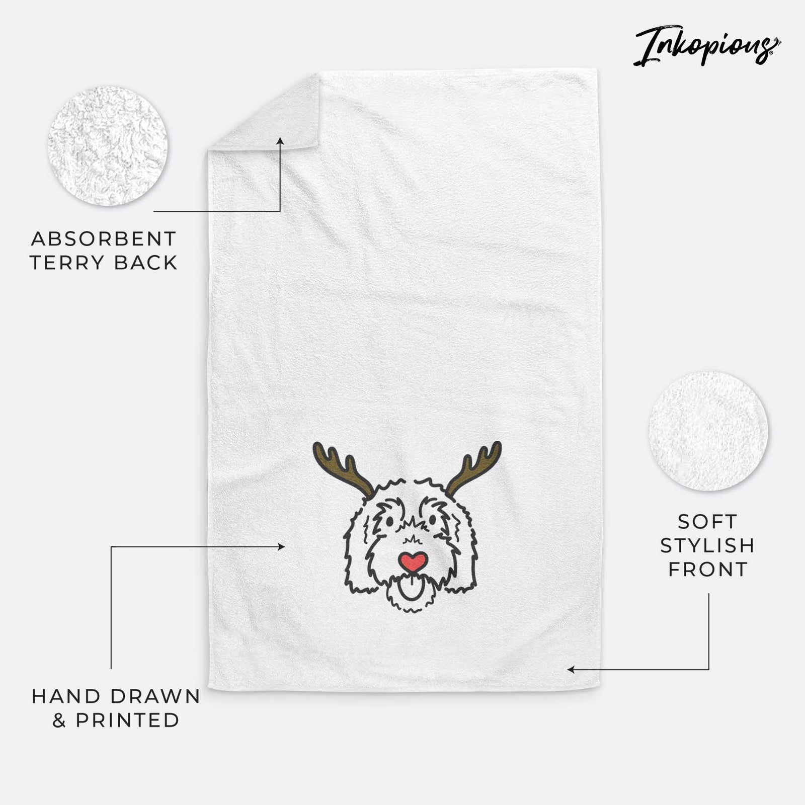 Minimalist line drawing of Gus the Goldendoodle with reindeer antlers and a red nose on a decorative hand towel
