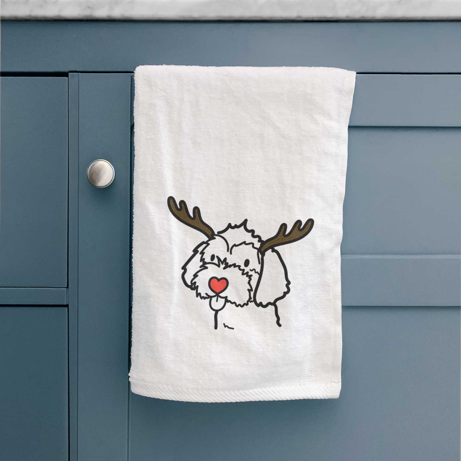 Minimalist line drawing of a Havapoo with reindeer antlers and a red nose on a decorative hand towel