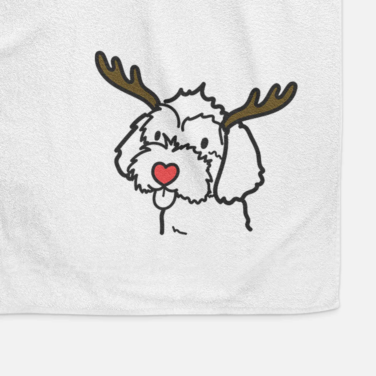 Minimalist line drawing of a Havapoo with reindeer antlers and a red nose on a decorative hand towel