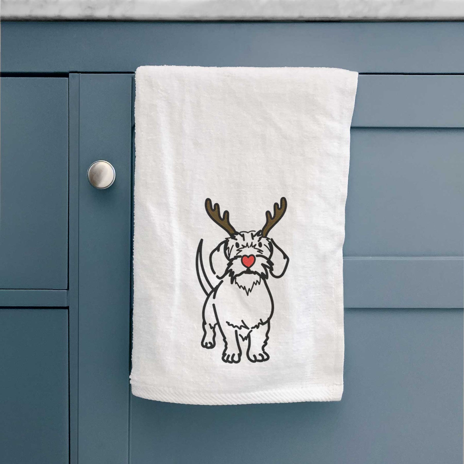 Minimalist line drawing of Henry the Wire Dachshund with reindeer antlers and a red nose on a decorative hand towel