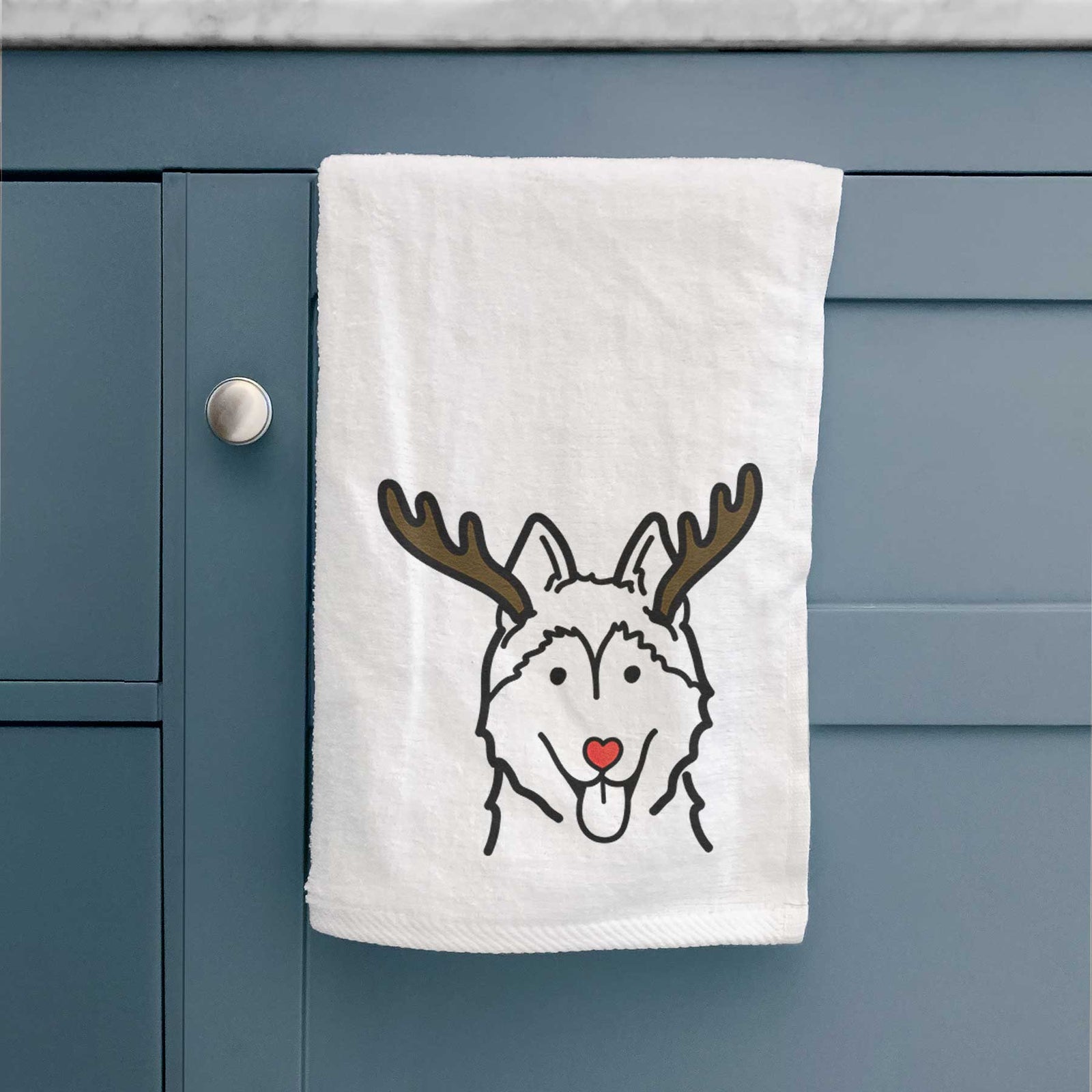 Minimalist line drawing of a Siberian Husky with reindeer antlers and a red nose on a decorative hand towel
