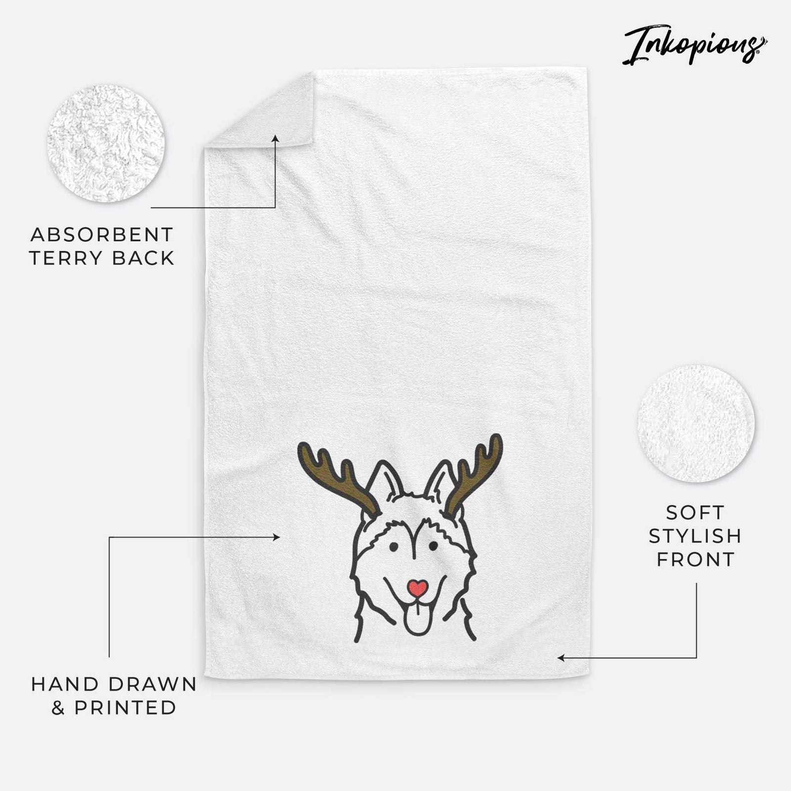 Minimalist line drawing of a Siberian Husky with reindeer antlers and a red nose on a decorative hand towel