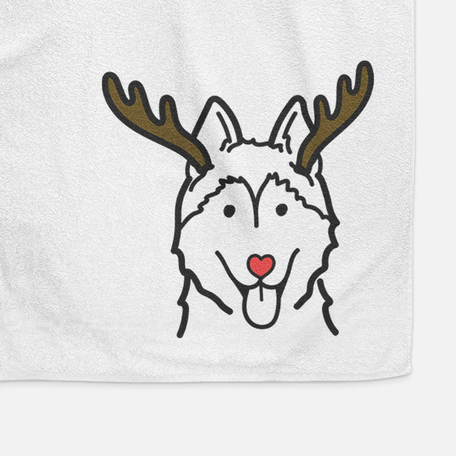 Minimalist line drawing of a Siberian Husky with reindeer antlers and a red nose on a decorative hand towel