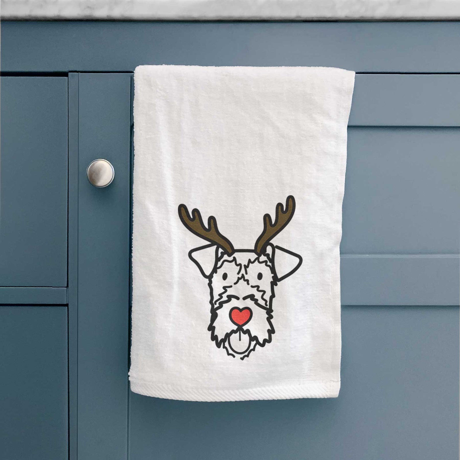 Minimalist line drawing of an Irish Terrier with reindeer antlers and a red nose on a decorative hand towel
