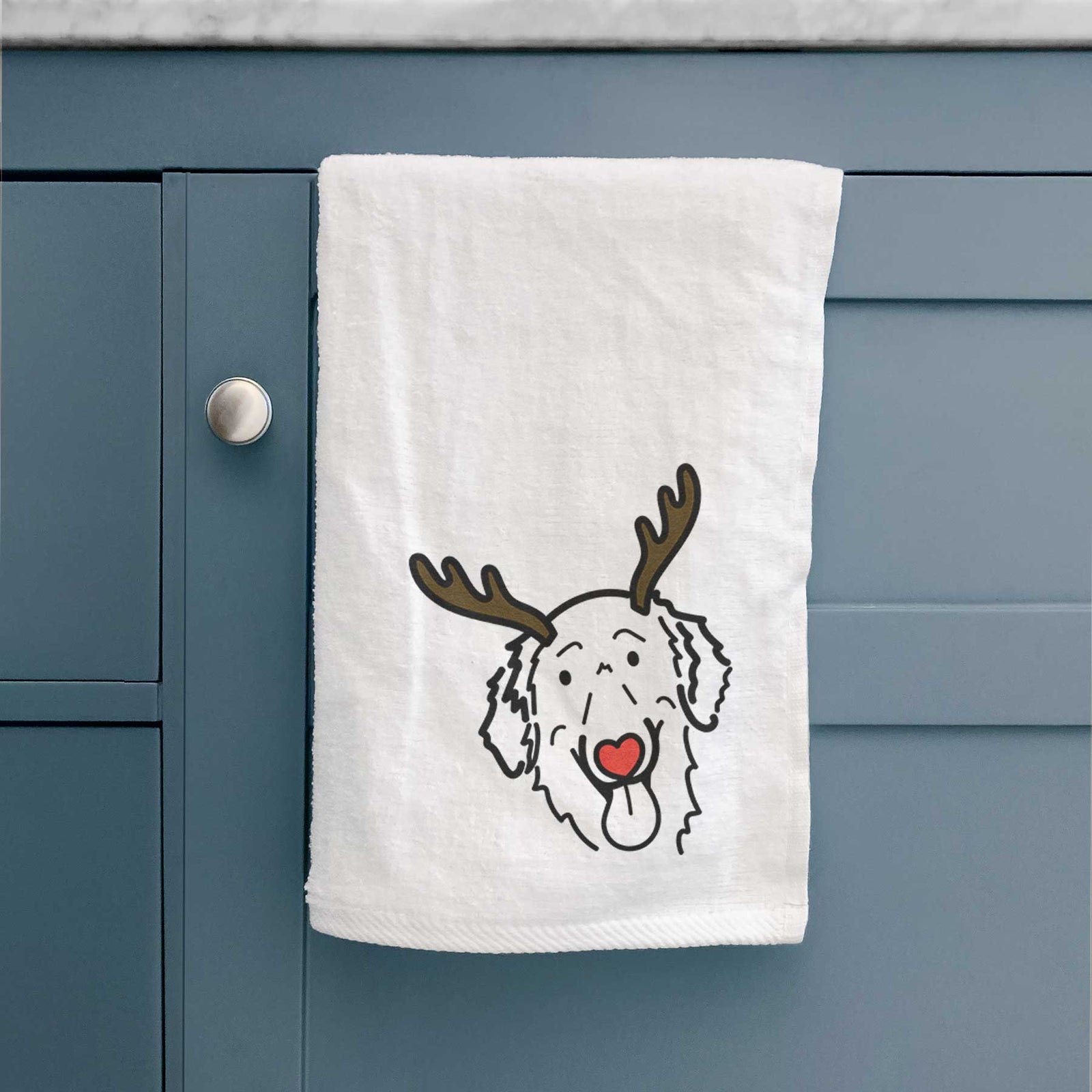 Minimalist line drawing of Jack the Flat-Coated Retriever with reindeer antlers and a red nose on a decorative hand towel