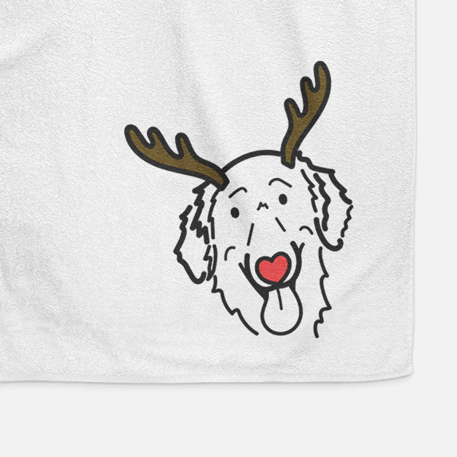Minimalist line drawing of Jack the Flat-Coated Retriever with reindeer antlers and a red nose on a decorative hand towel