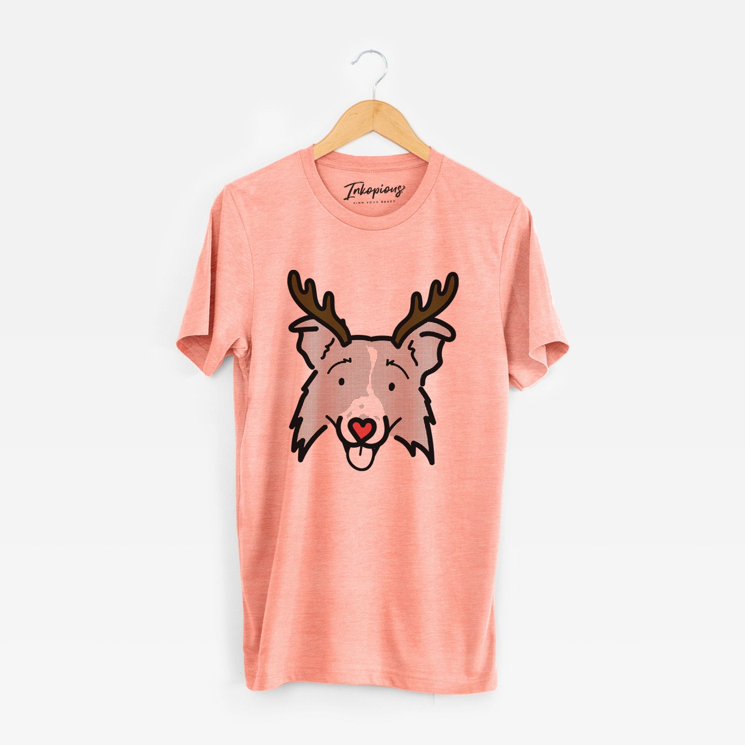 Minimalist line drawing of Jam the Border Collie 2.0 with reindeer antlers and a red nose on a Sunset Unisex crewneck