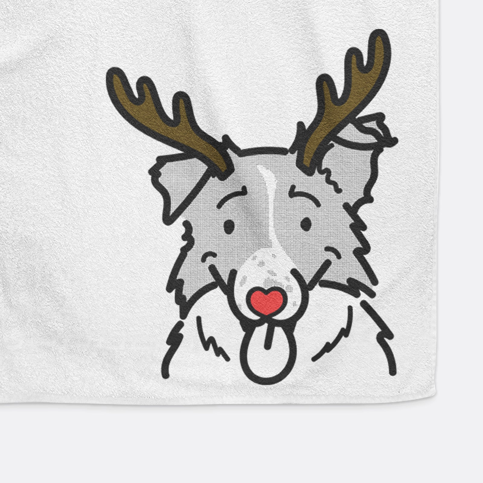 Minimalist line drawing of Jam the Border Collie with reindeer antlers and a red nose on a decorative hand towel