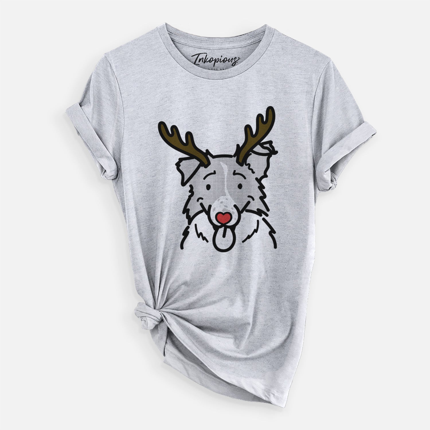 Minimalist line drawing of Jam the Border Collie with reindeer antlers and a red nose on a Grey Unisex crewneck