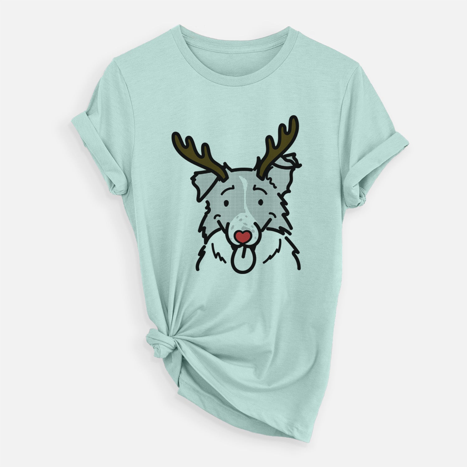 Minimalist line drawing of Jam the Border Collie with reindeer antlers and a red nose on a Heather Sage Unisex crewneck