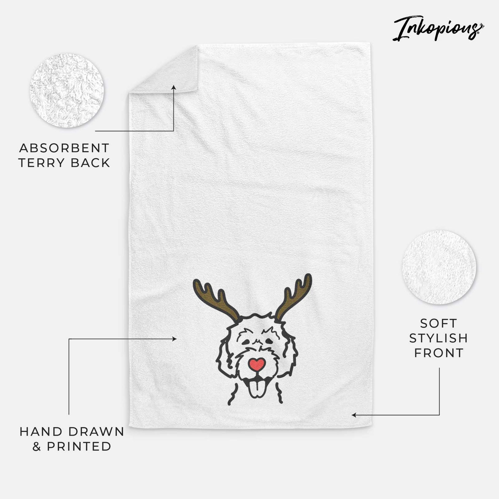 Minimalist line drawing of a Labradoodle with reindeer antlers and a red nose on a decorative hand towel